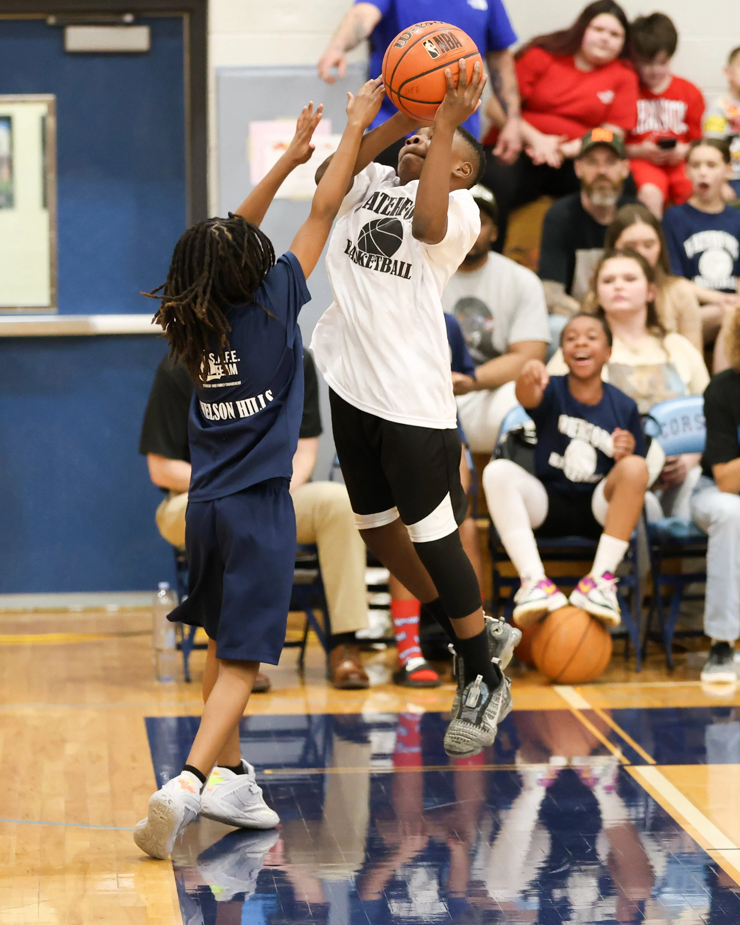 Beaumont boy shoots the ball over Donelson Hills boy