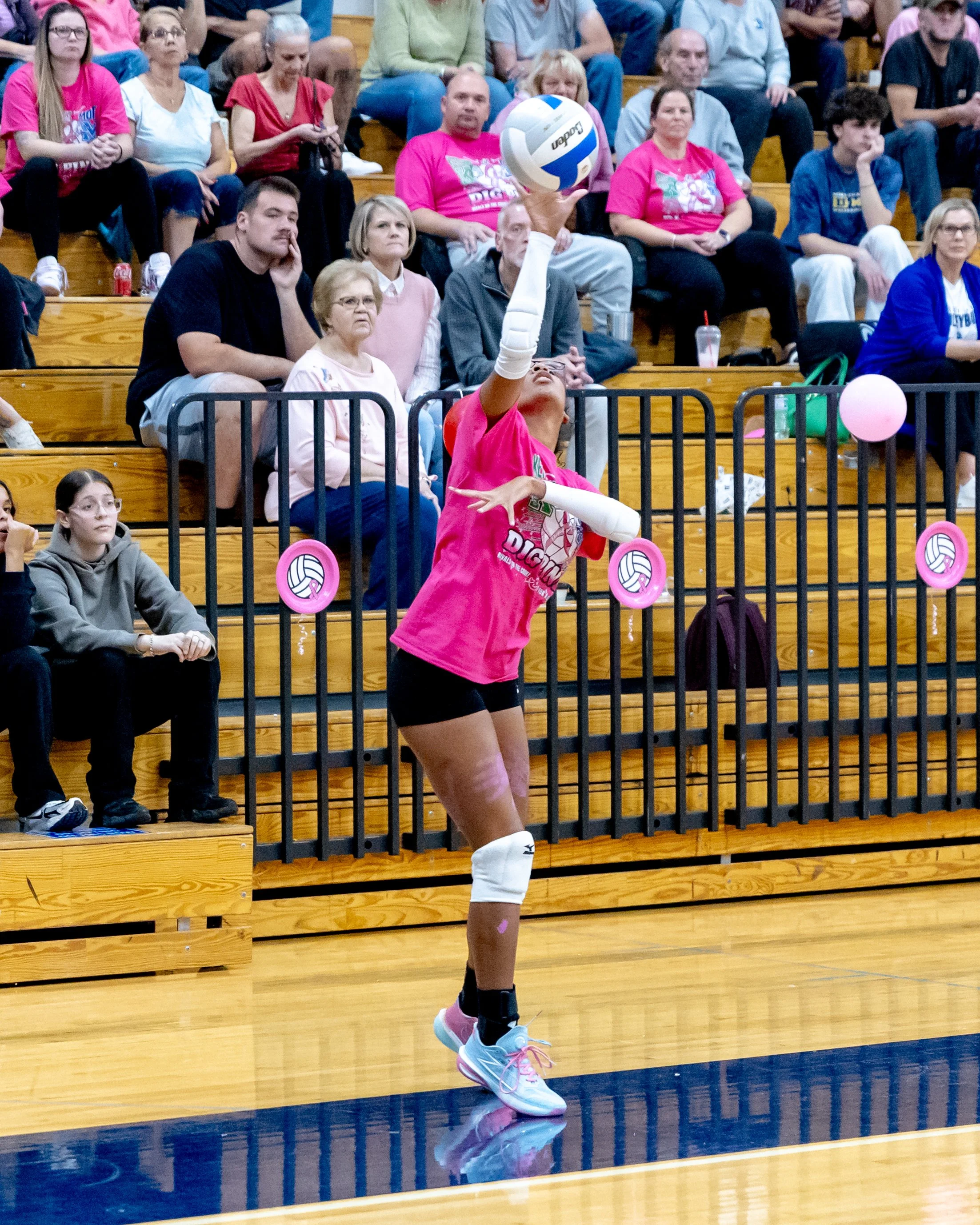 Kettering serves the ball