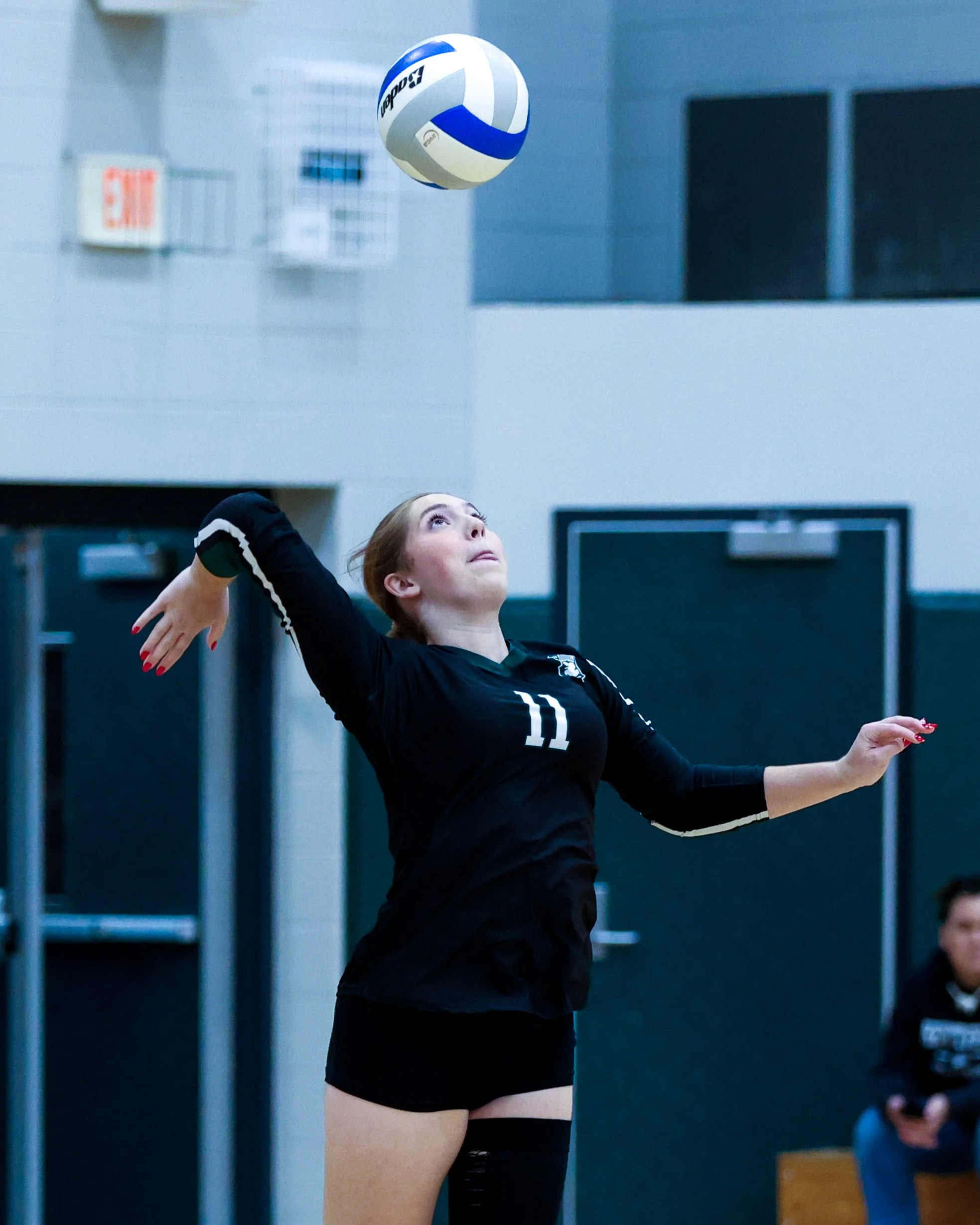 WK #11 serves the ball
