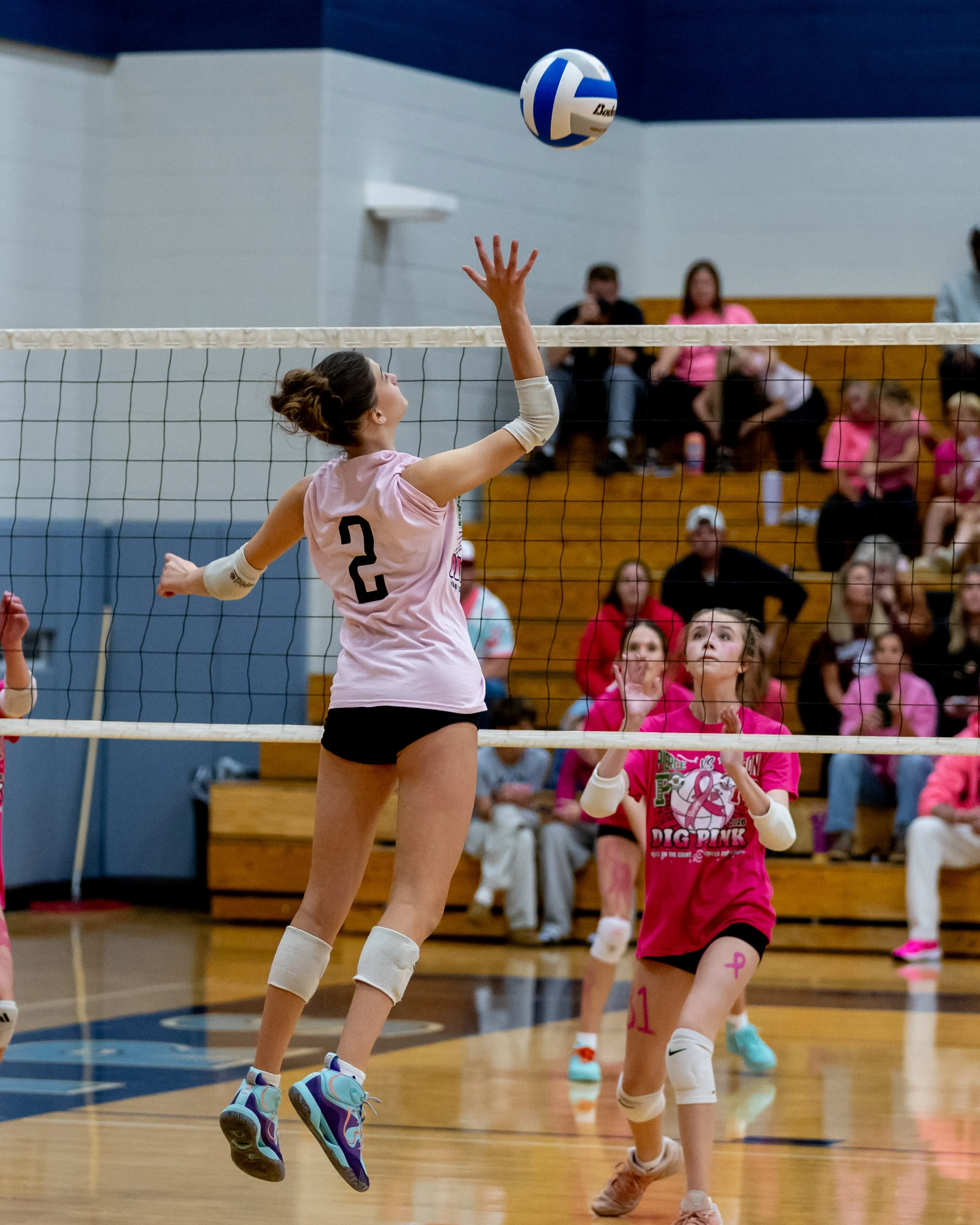 Mason player hits the ball