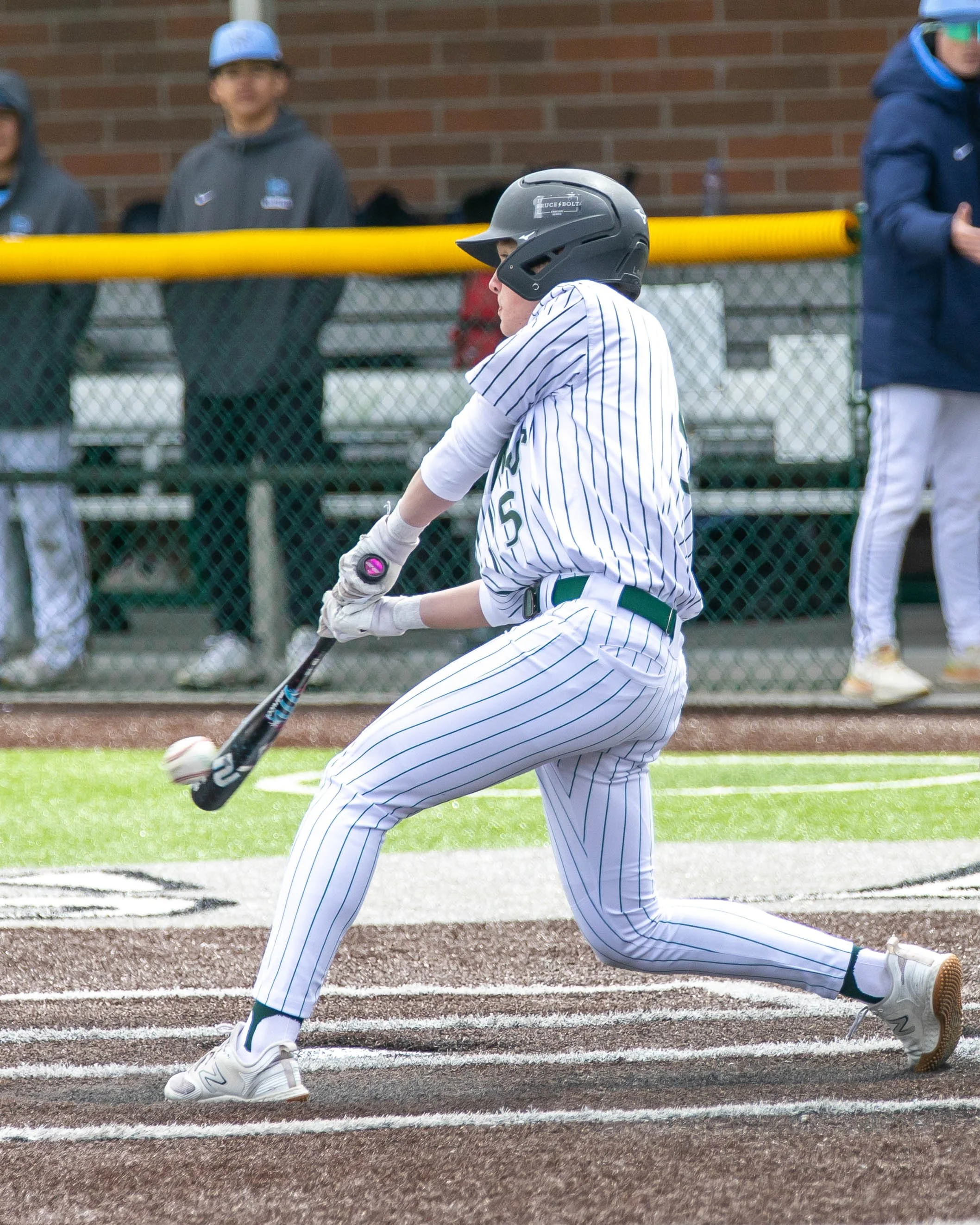 Kettering #5 gets the ball on the bat