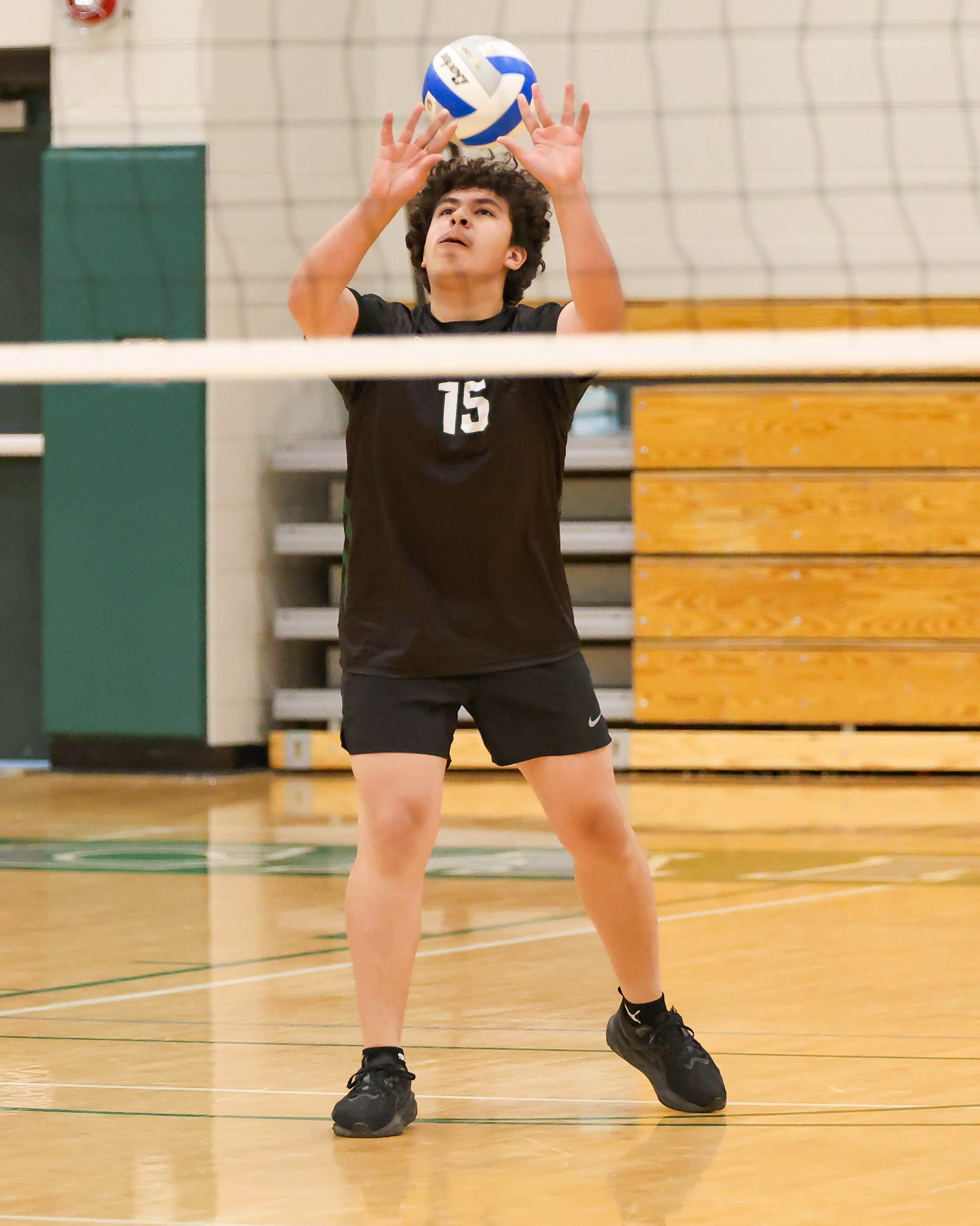 Kettering #15 sets the ball