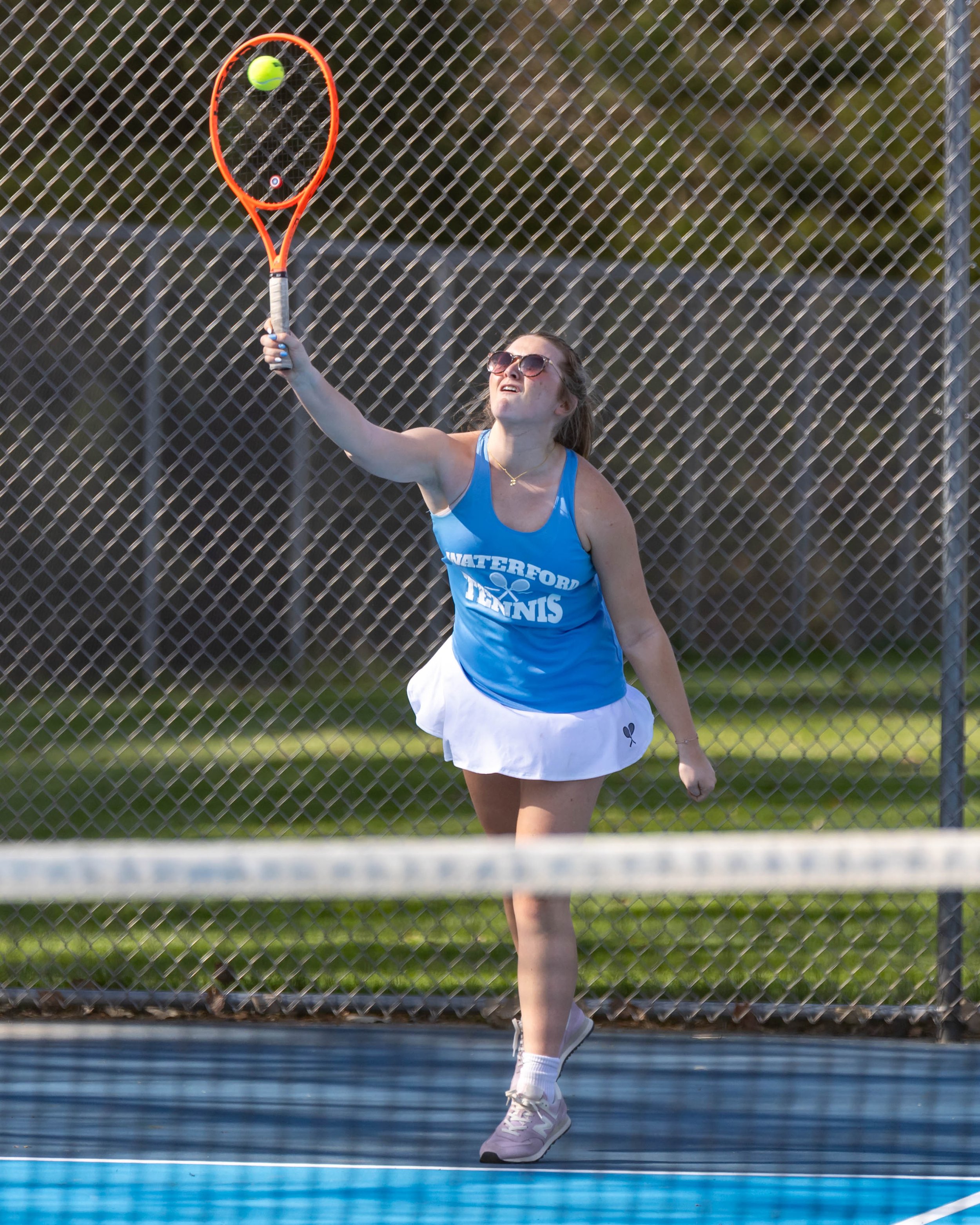 Waterford United player serves the ball