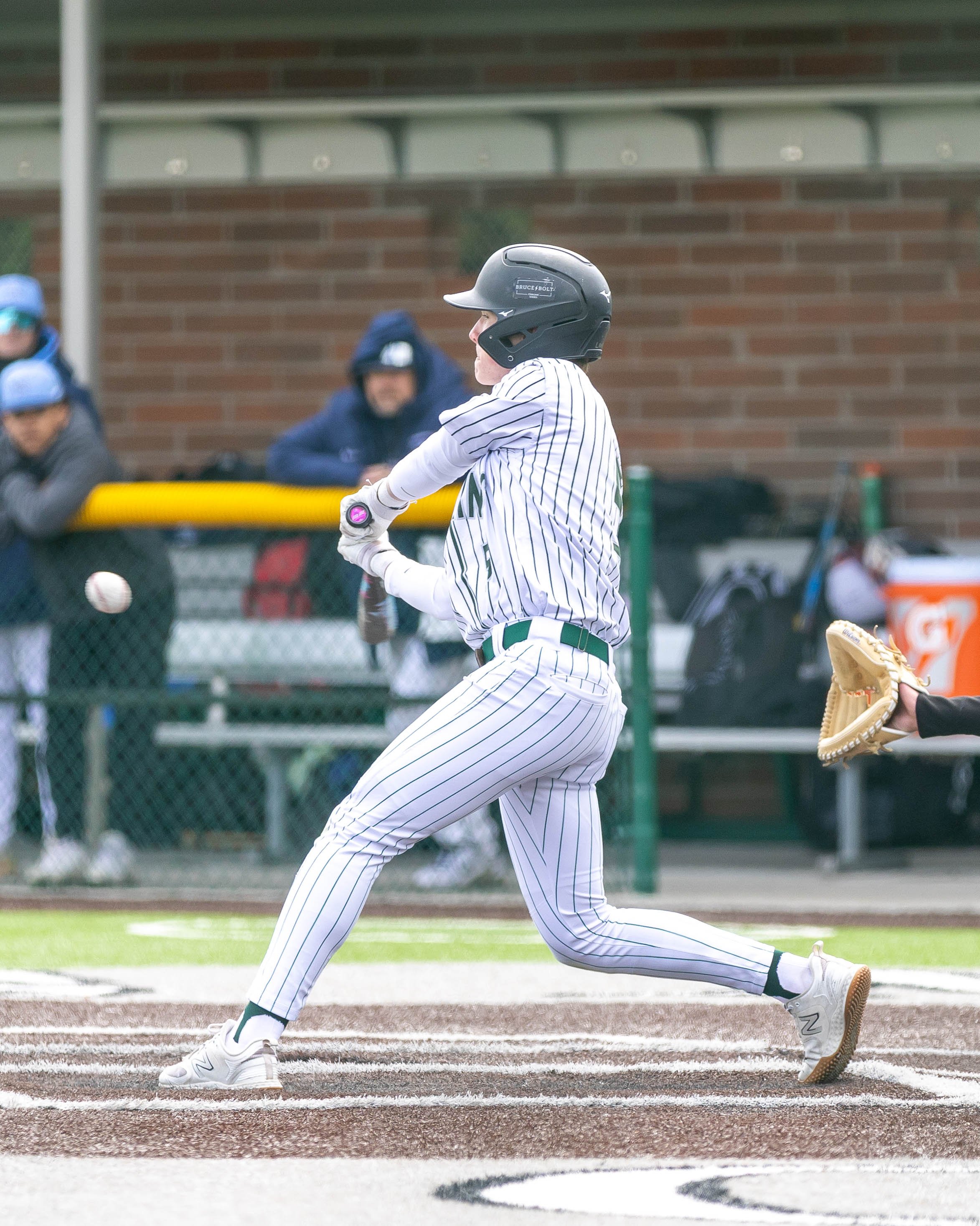 Kettering # 5 swings at the ball