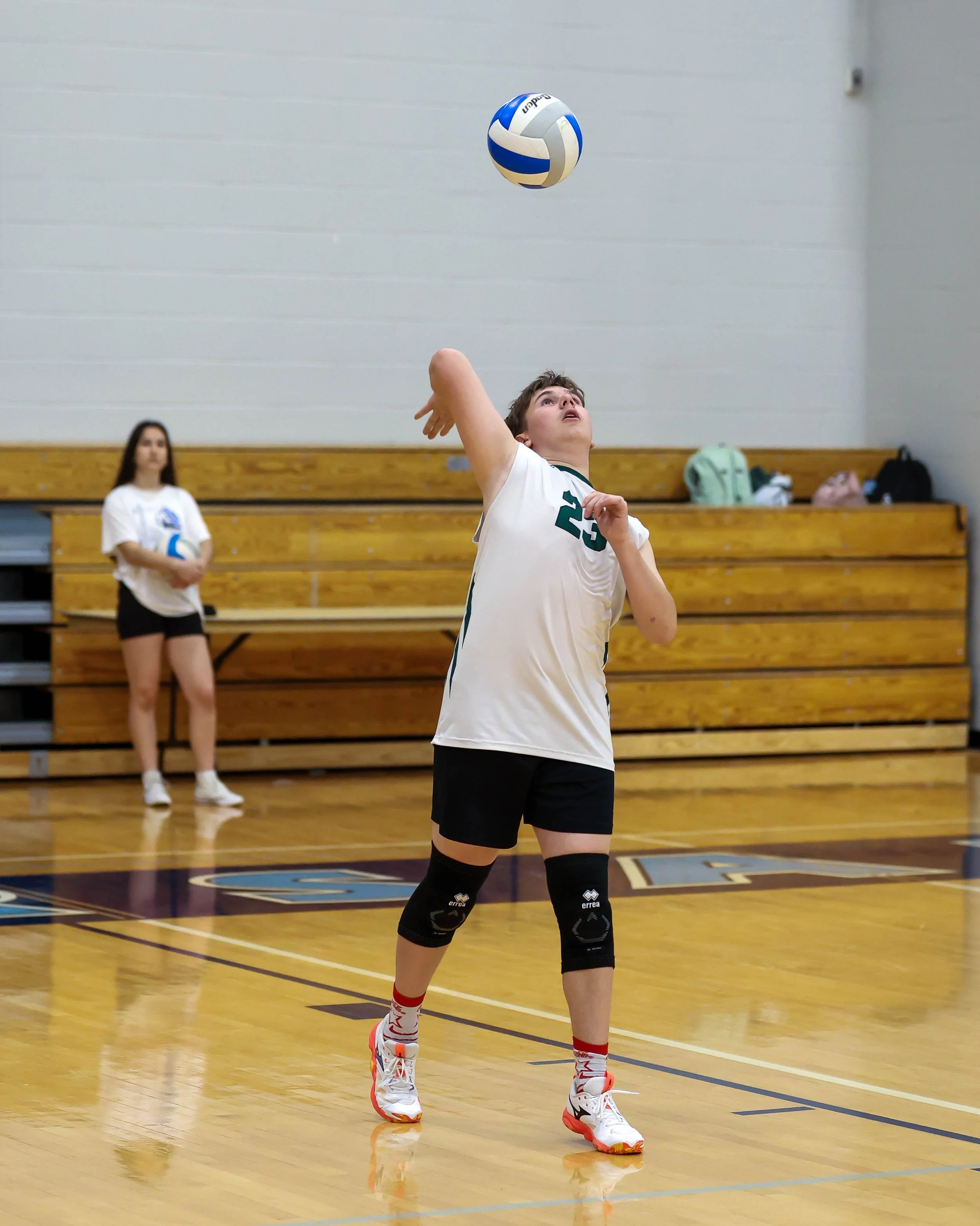 Kettering #23 serves the ball