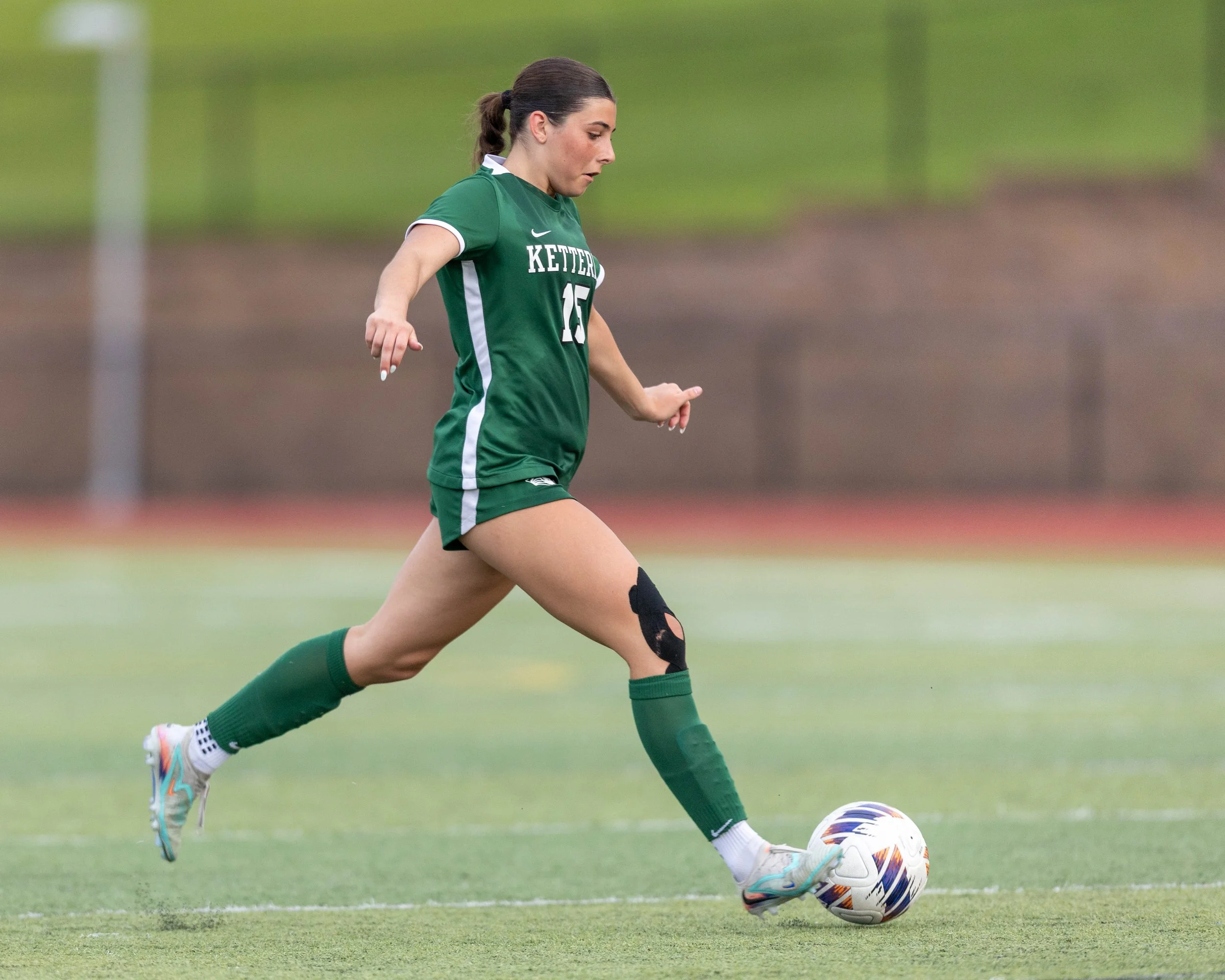 #15 dribbles the ball