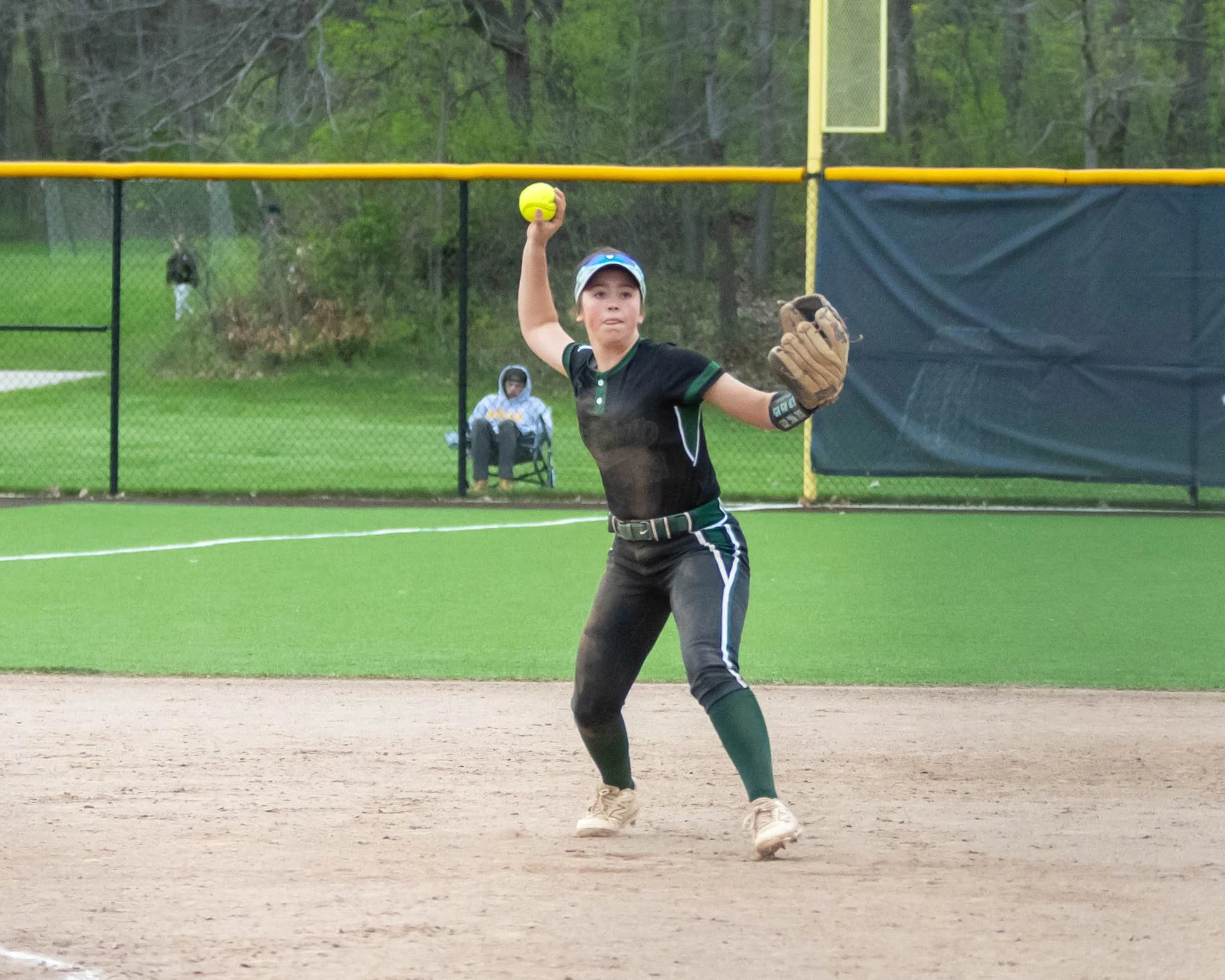 Kettering short stop throws to first base
