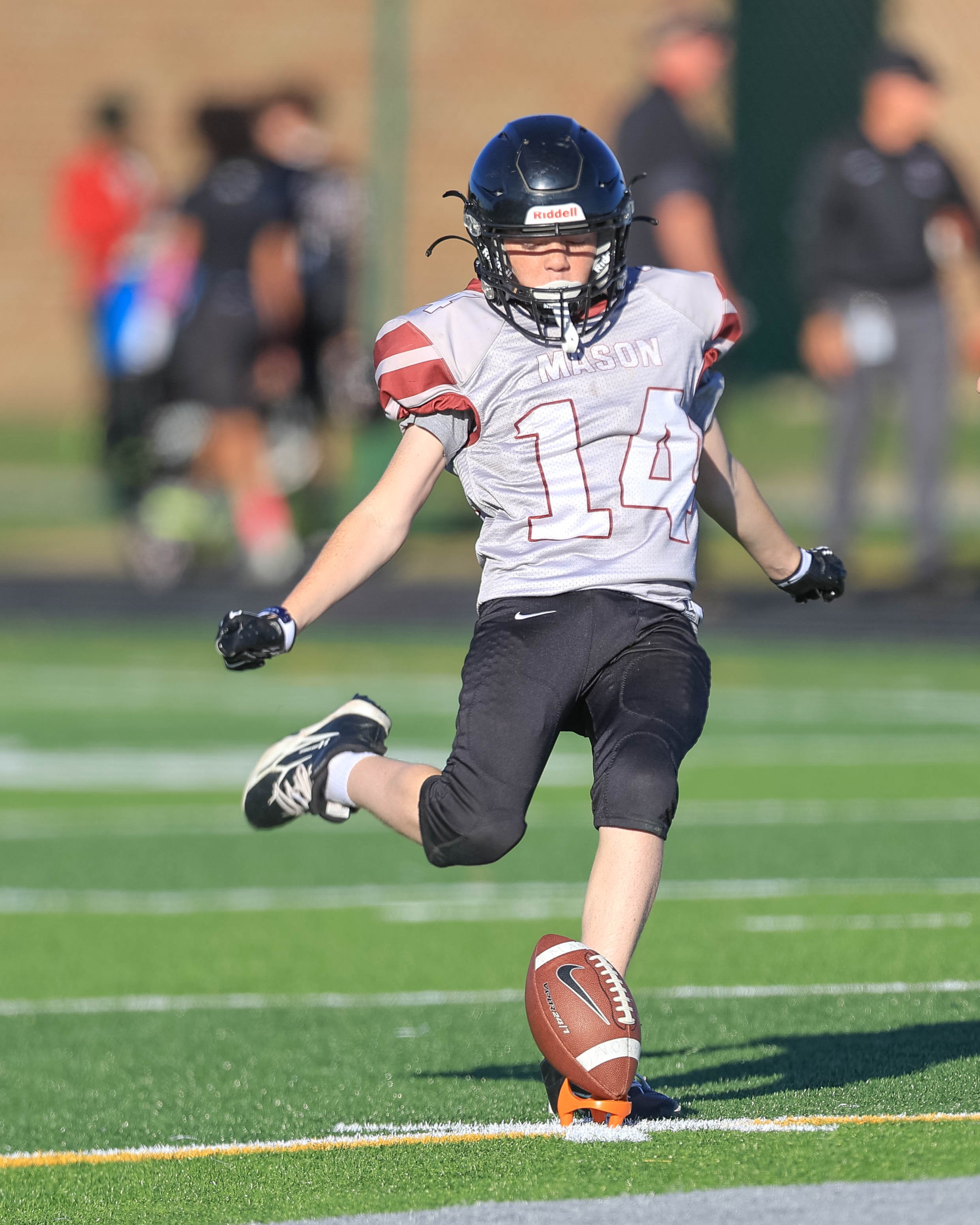 Mason #14 kicks off the second half