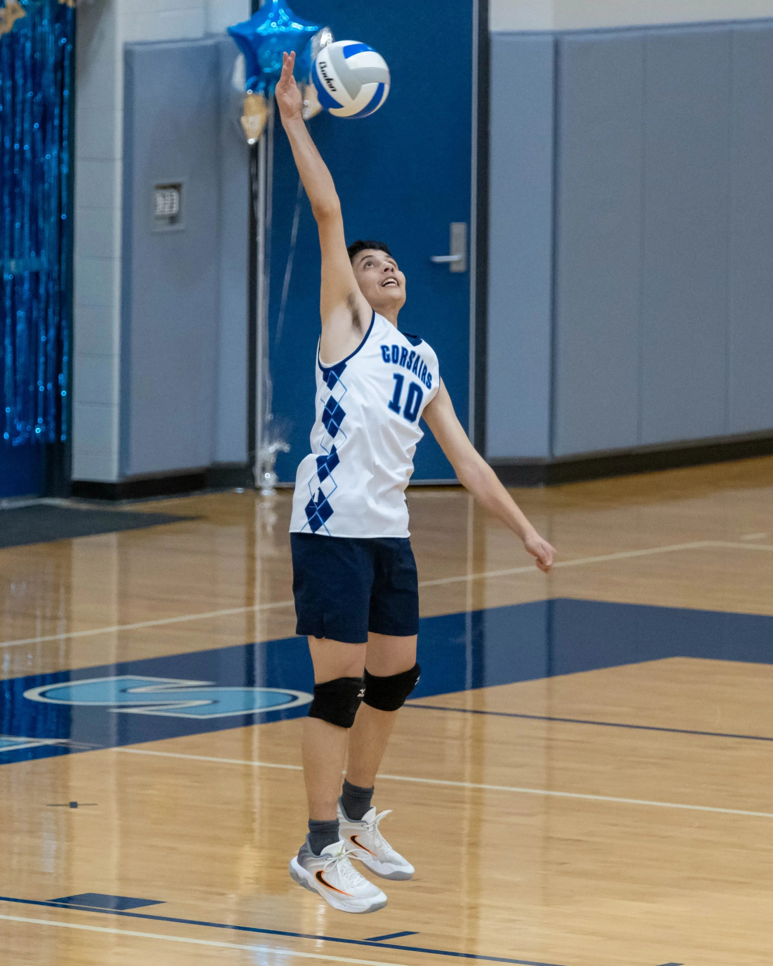 #10 serves the ball