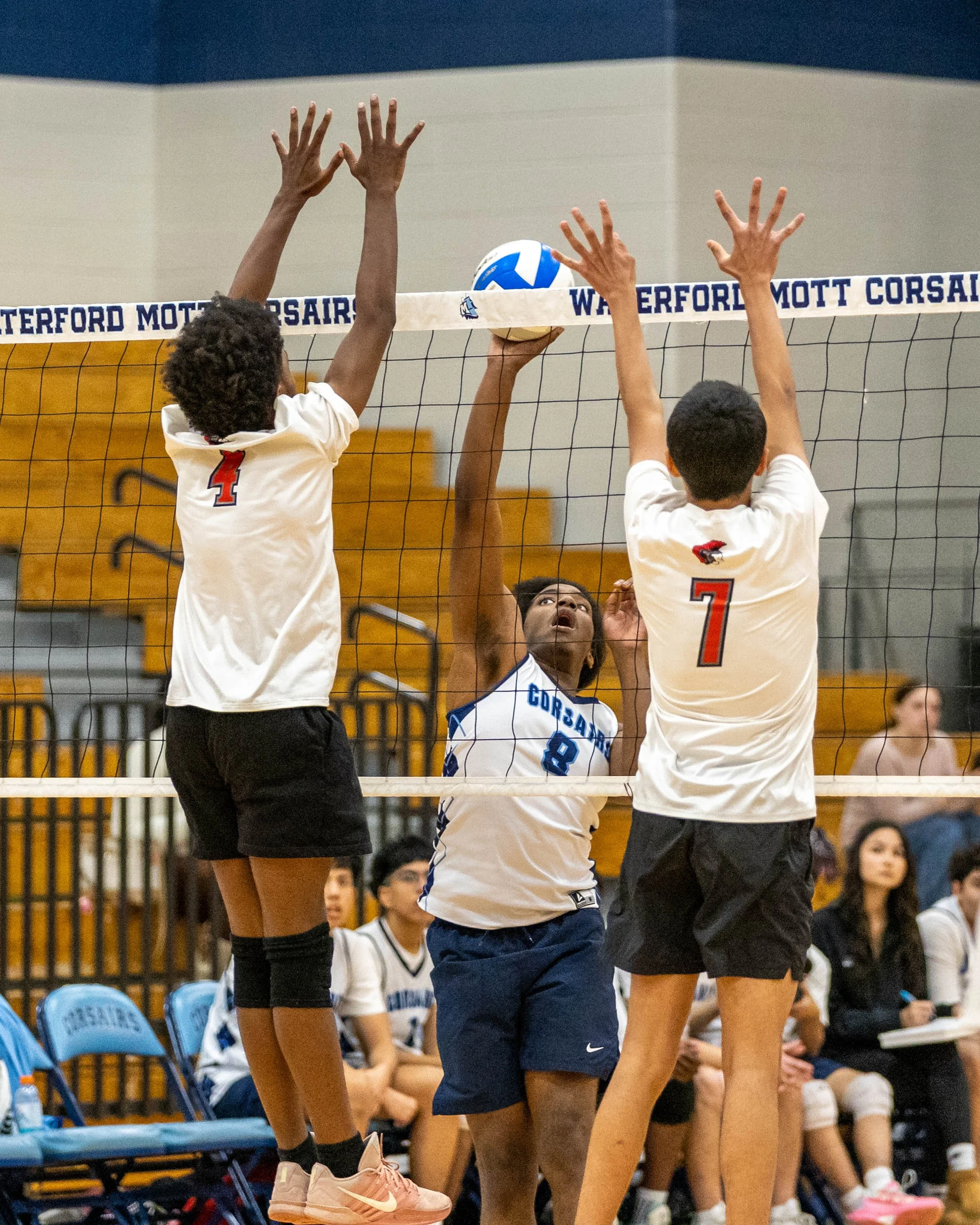 #8 returns the ball over the net
