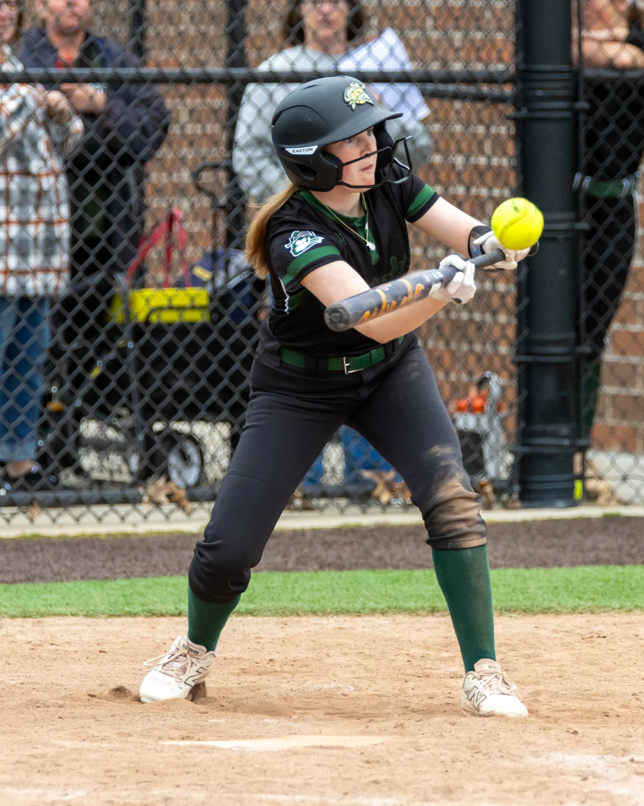 Kettering player bunts the ball