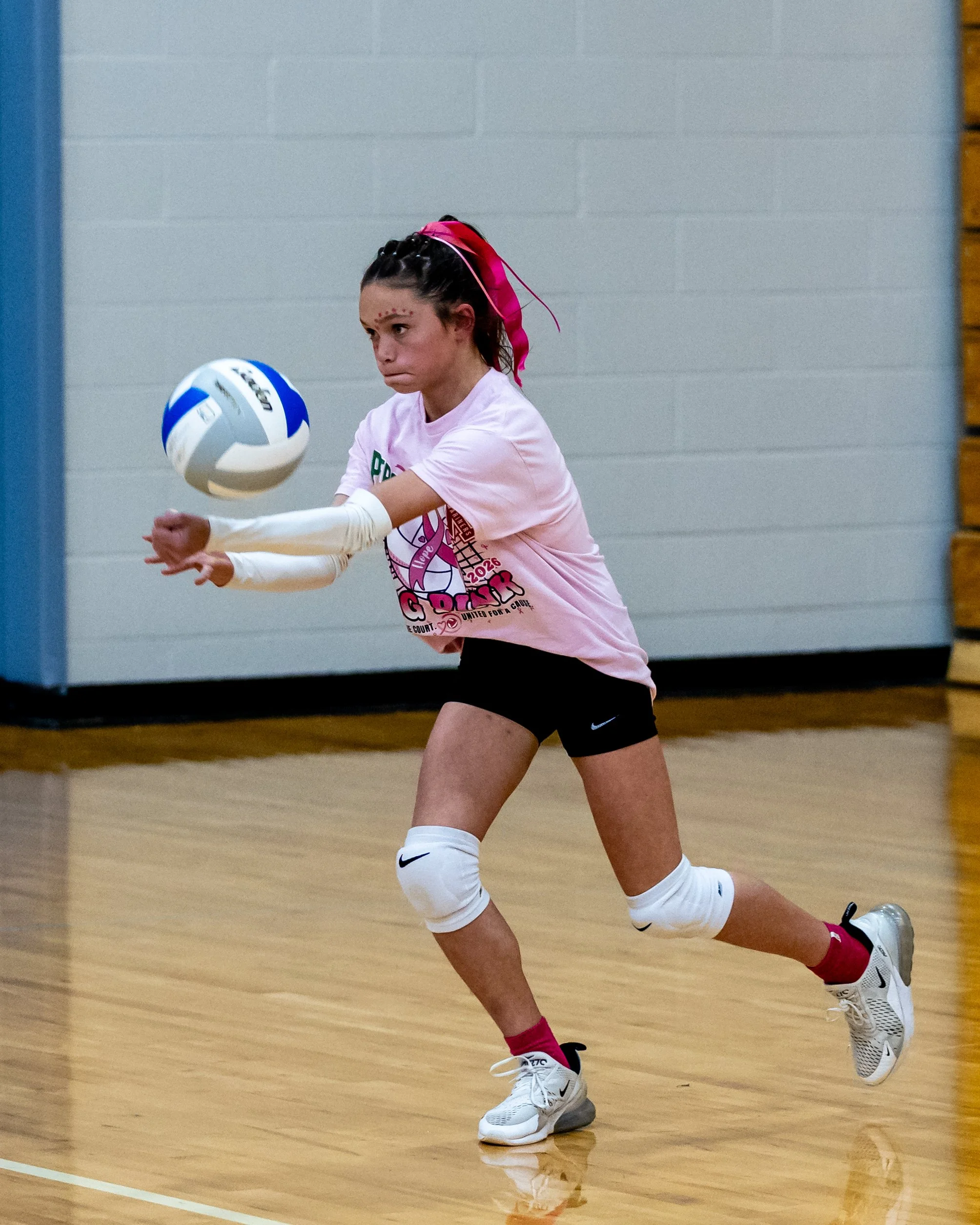 Mason player hits the ball