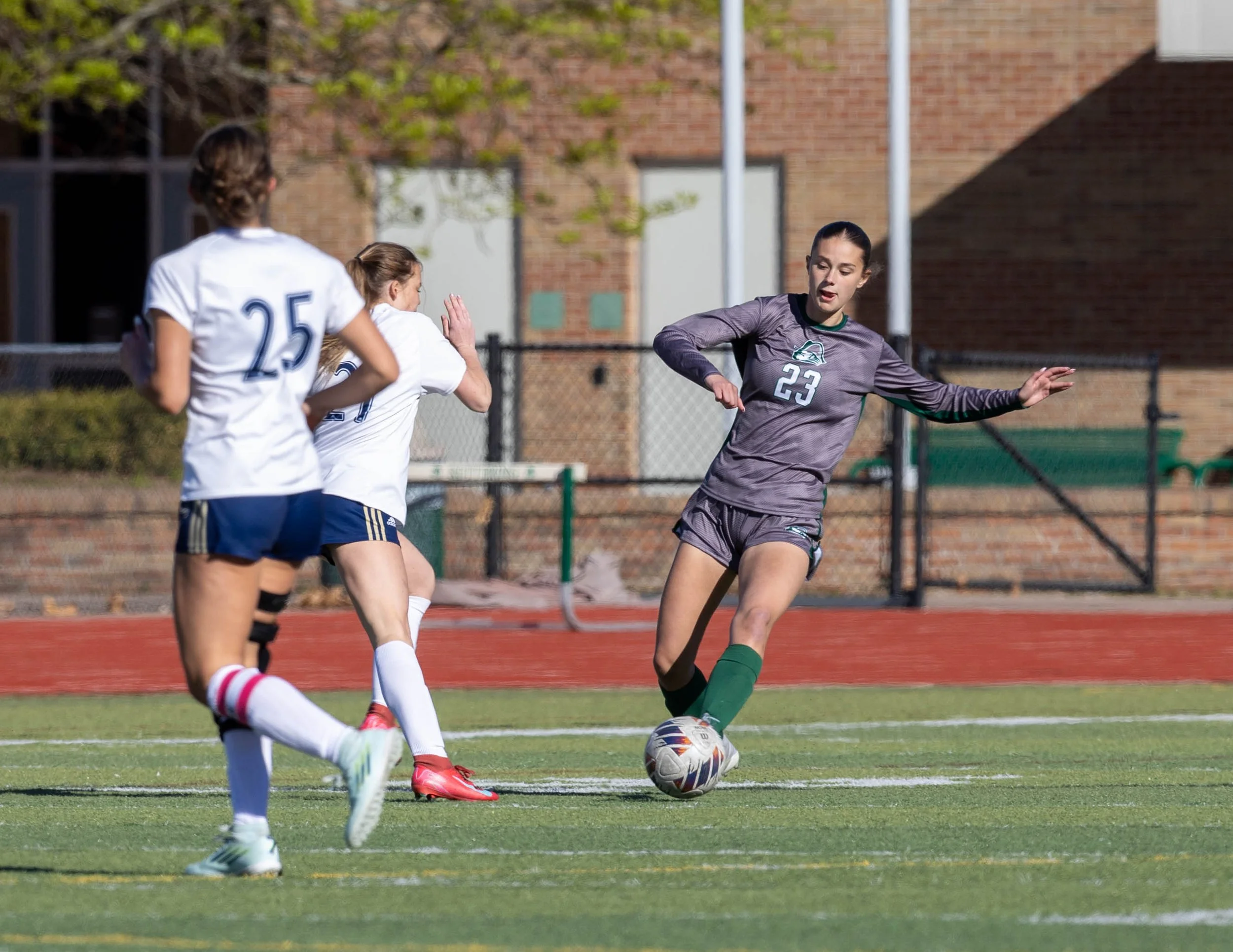 #23 kicking the ball