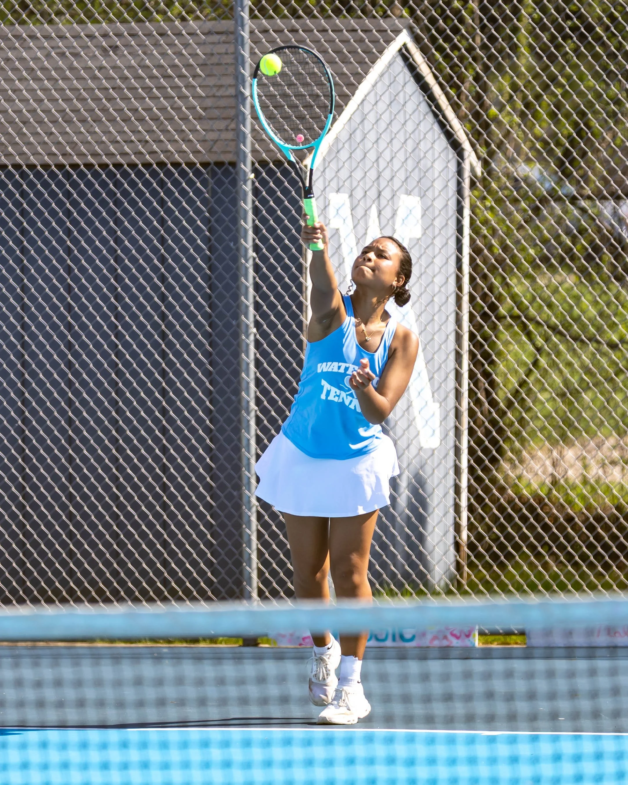 Waterford United player serves the ball