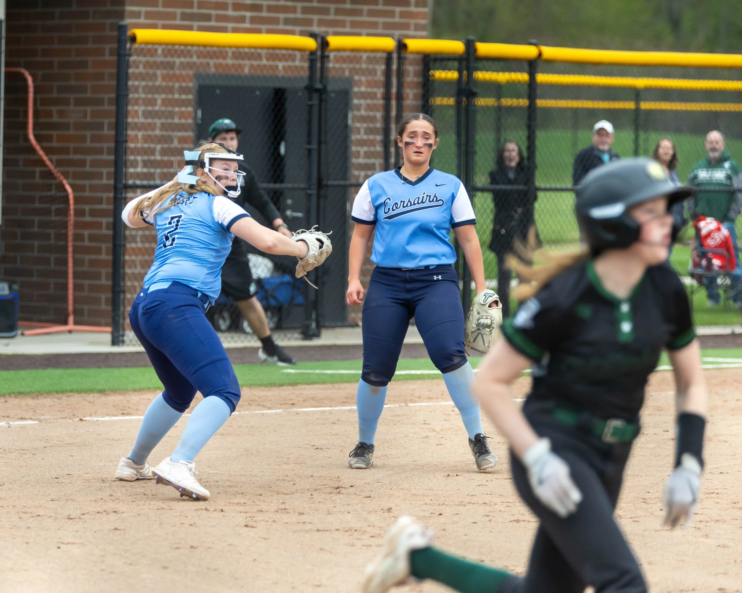 Mott pitcher throws the ball to first base