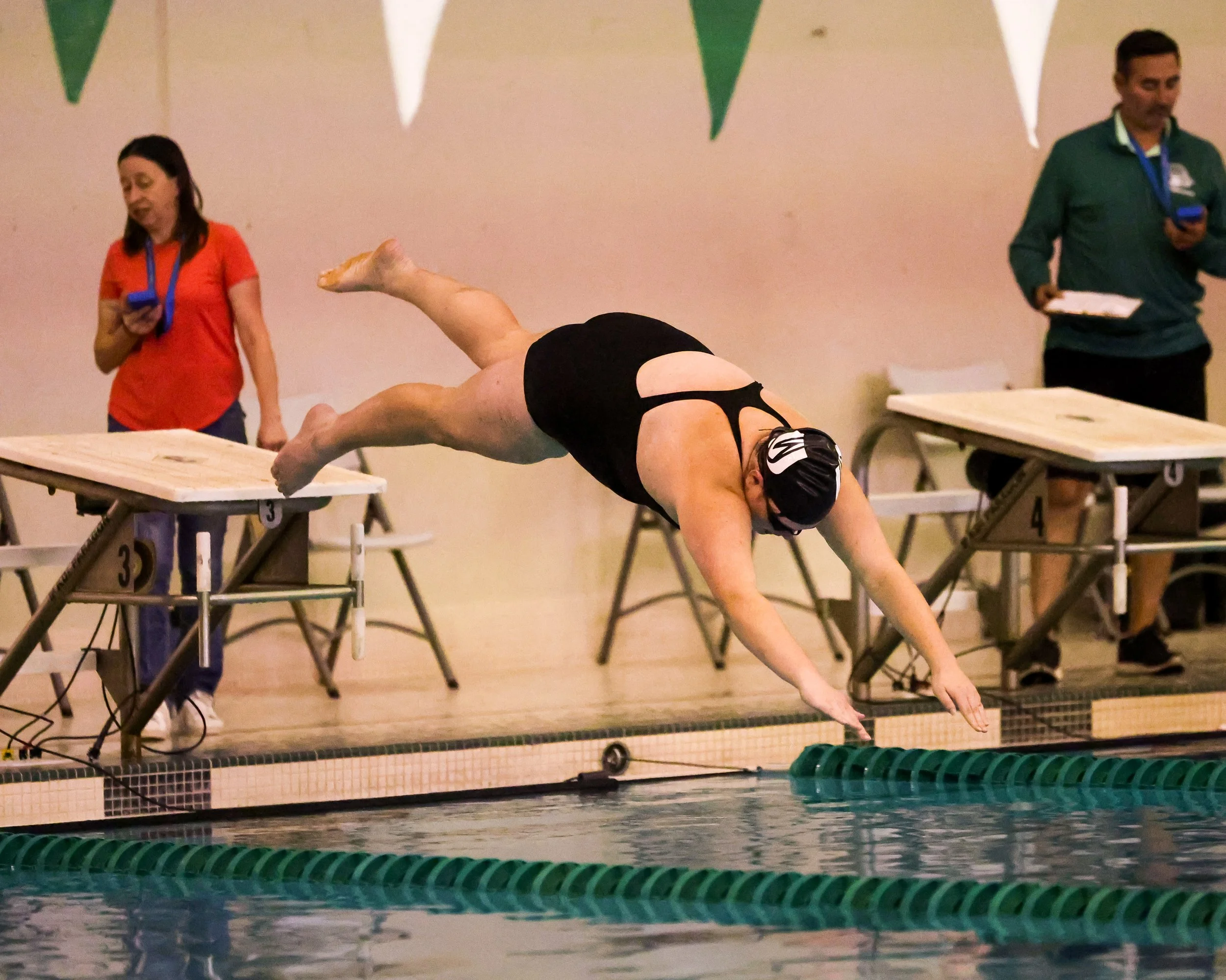 WU swimmer starts the 100 Yard Breaststroke