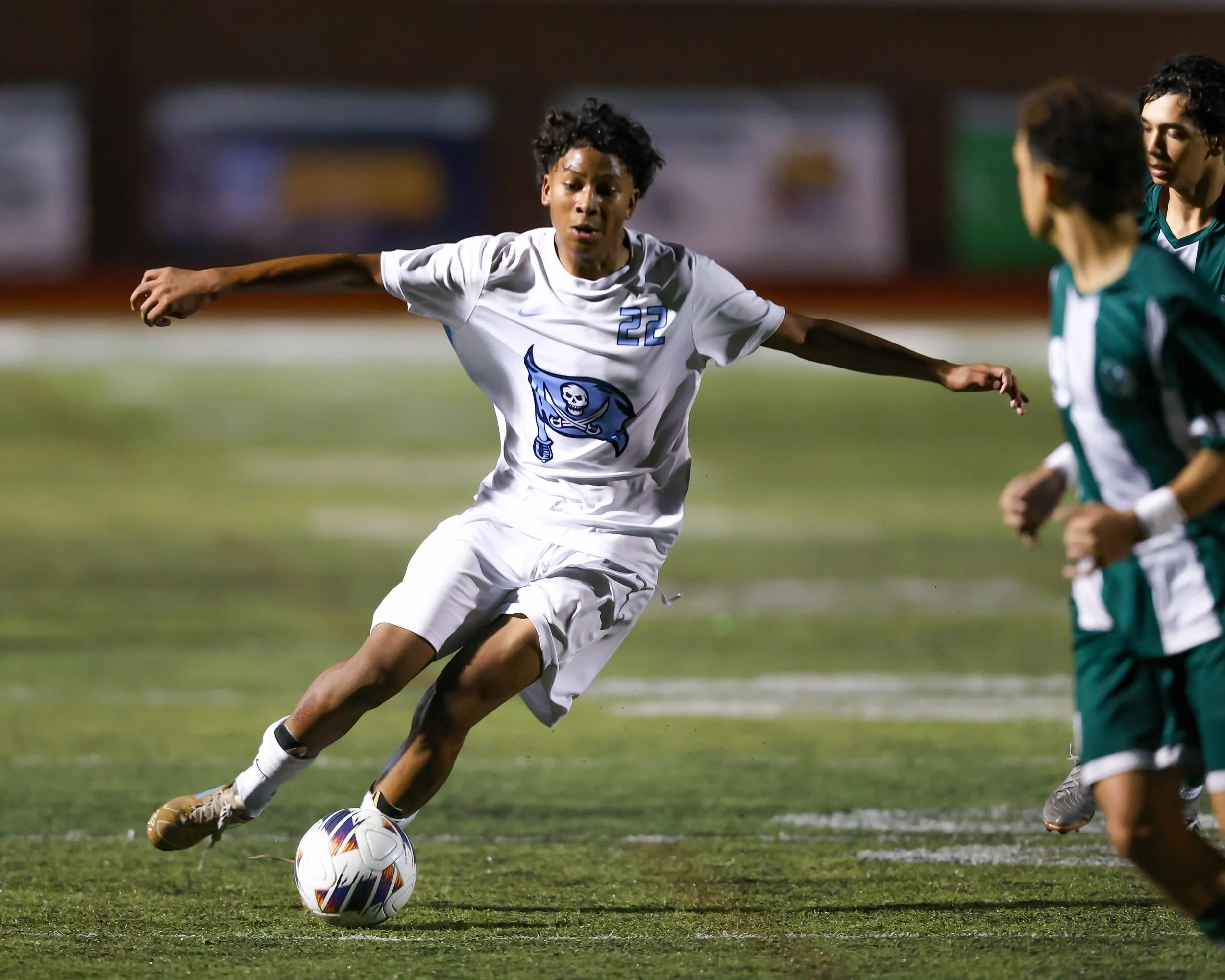 WM #22 kicks the ball