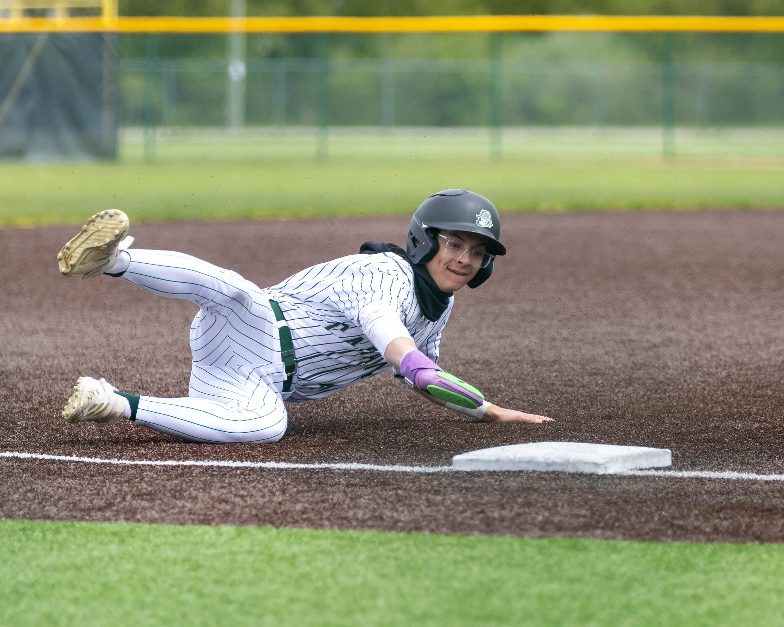 Kettering #4 slides into 3rd base
