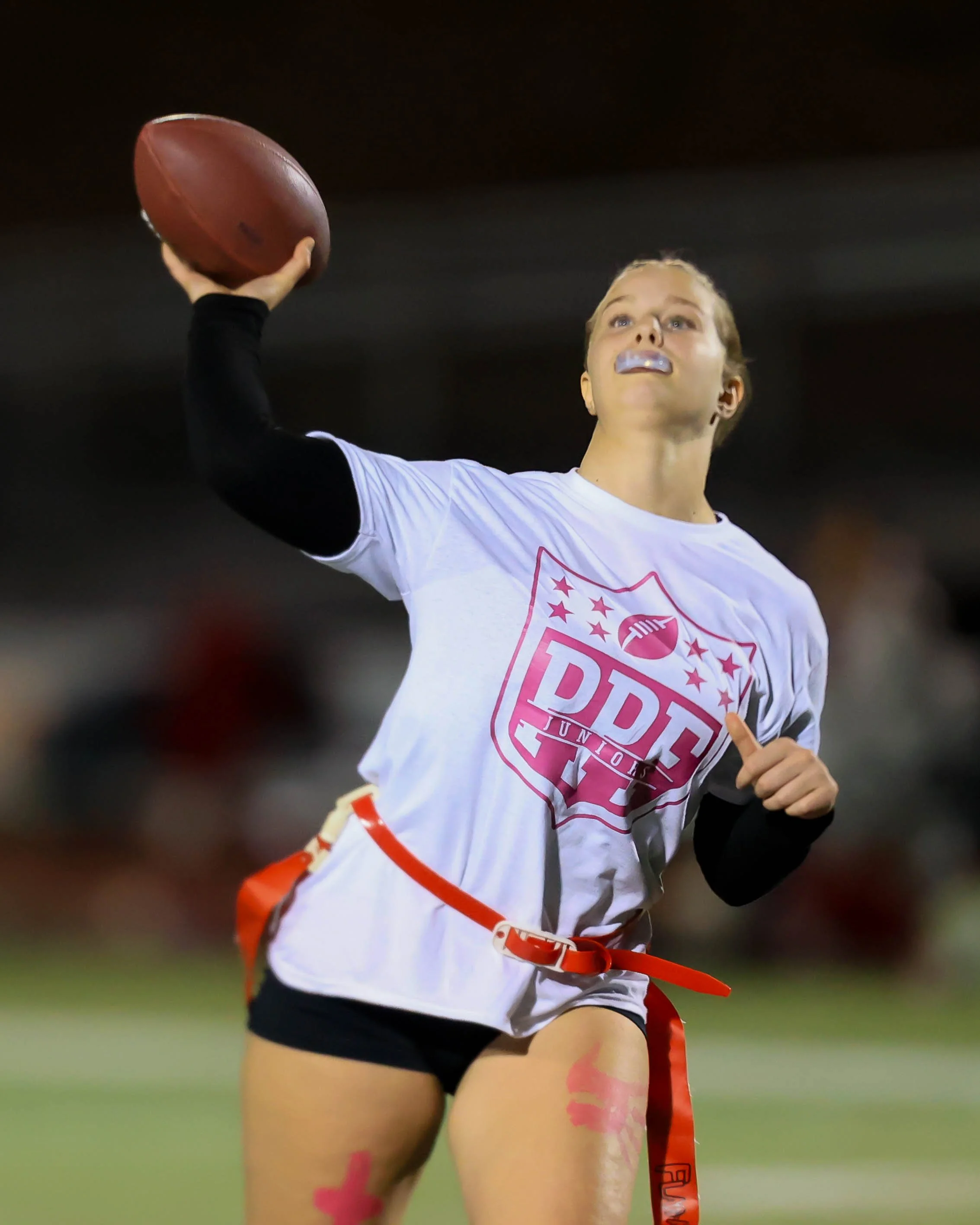 Junior quarterback throws the ball