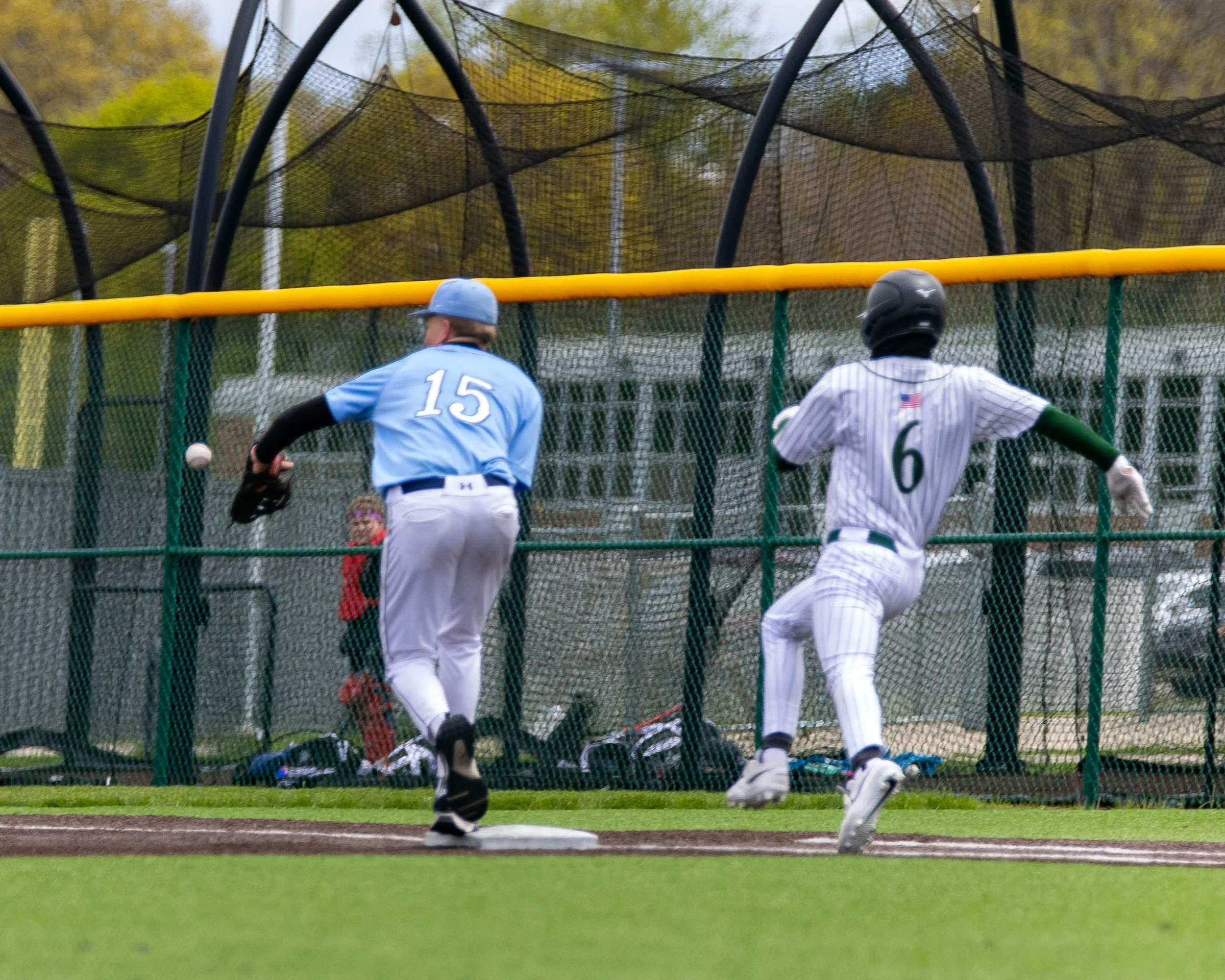 Mott #15 catches the ballot 1st Base with Kettering #6 running to 1st base