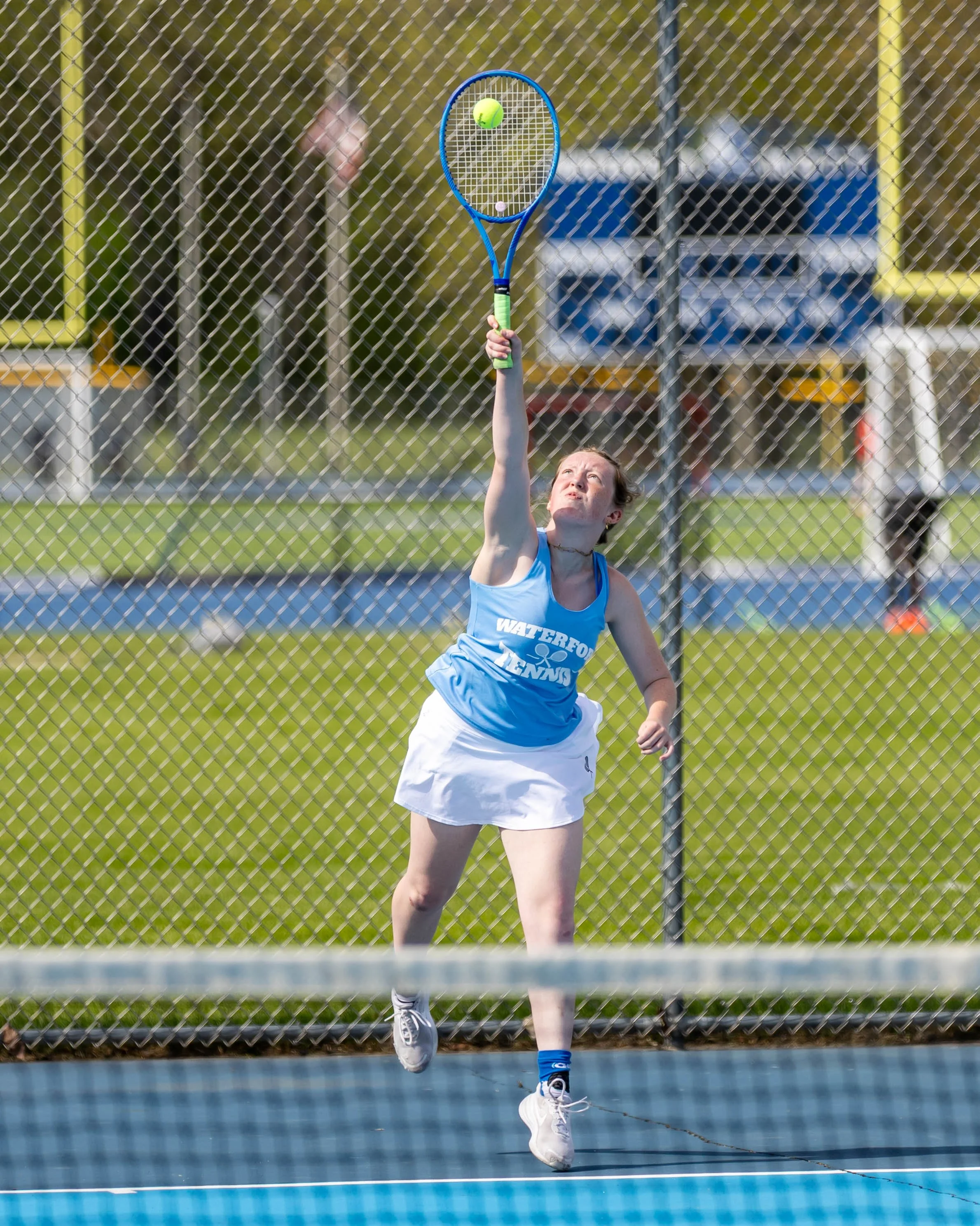 Jayden serves the ball