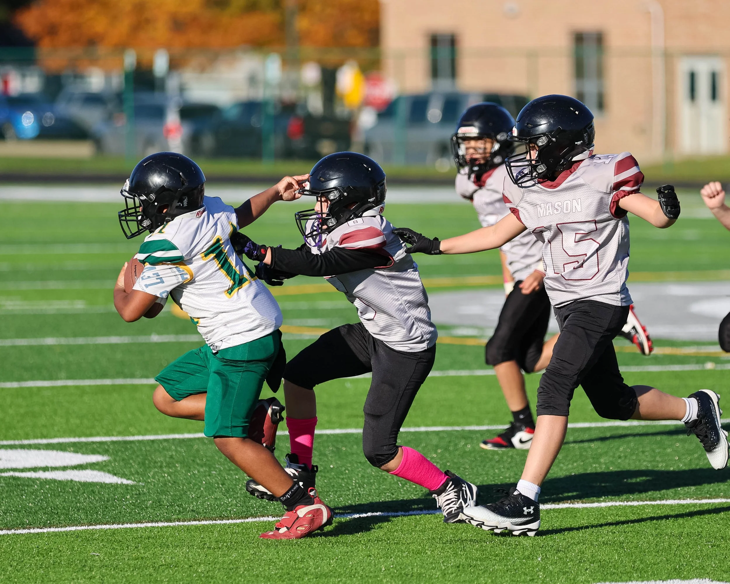 Pierce #11 chased by a host of Mason defenders