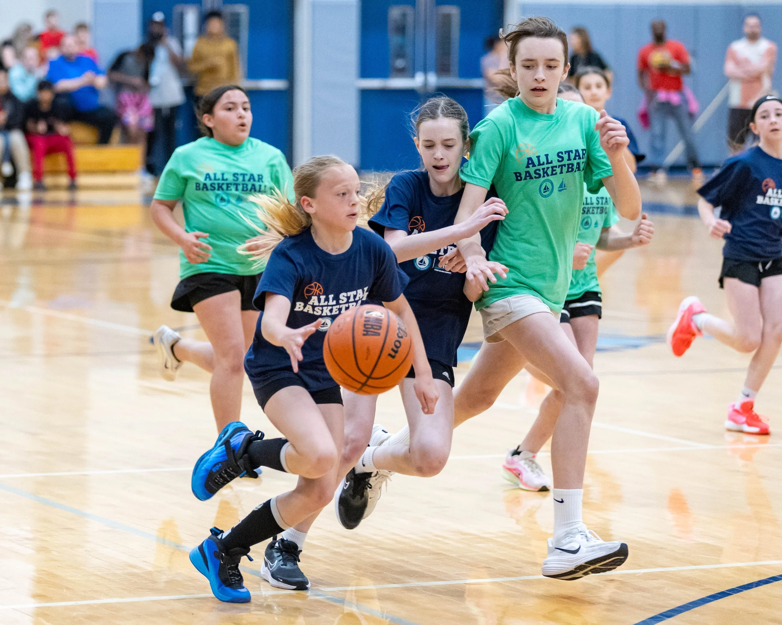 North girl carries dribbles the ball 