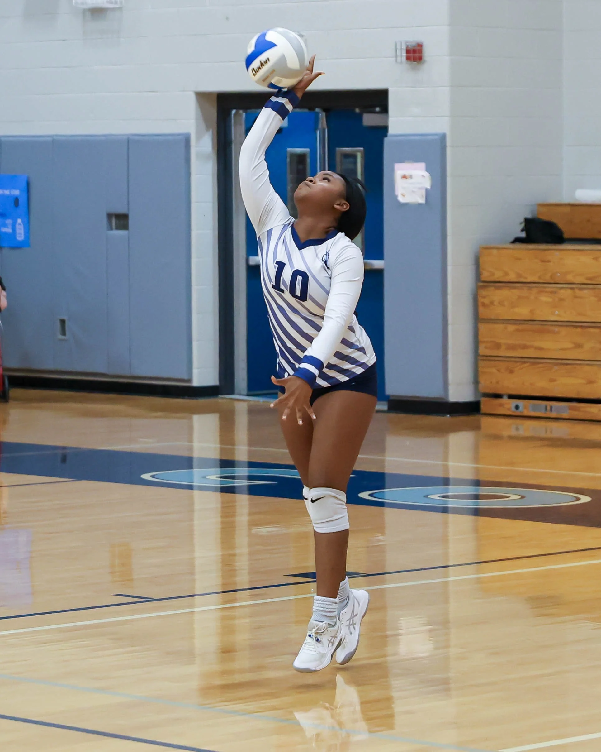 Mott #10 serves the ball