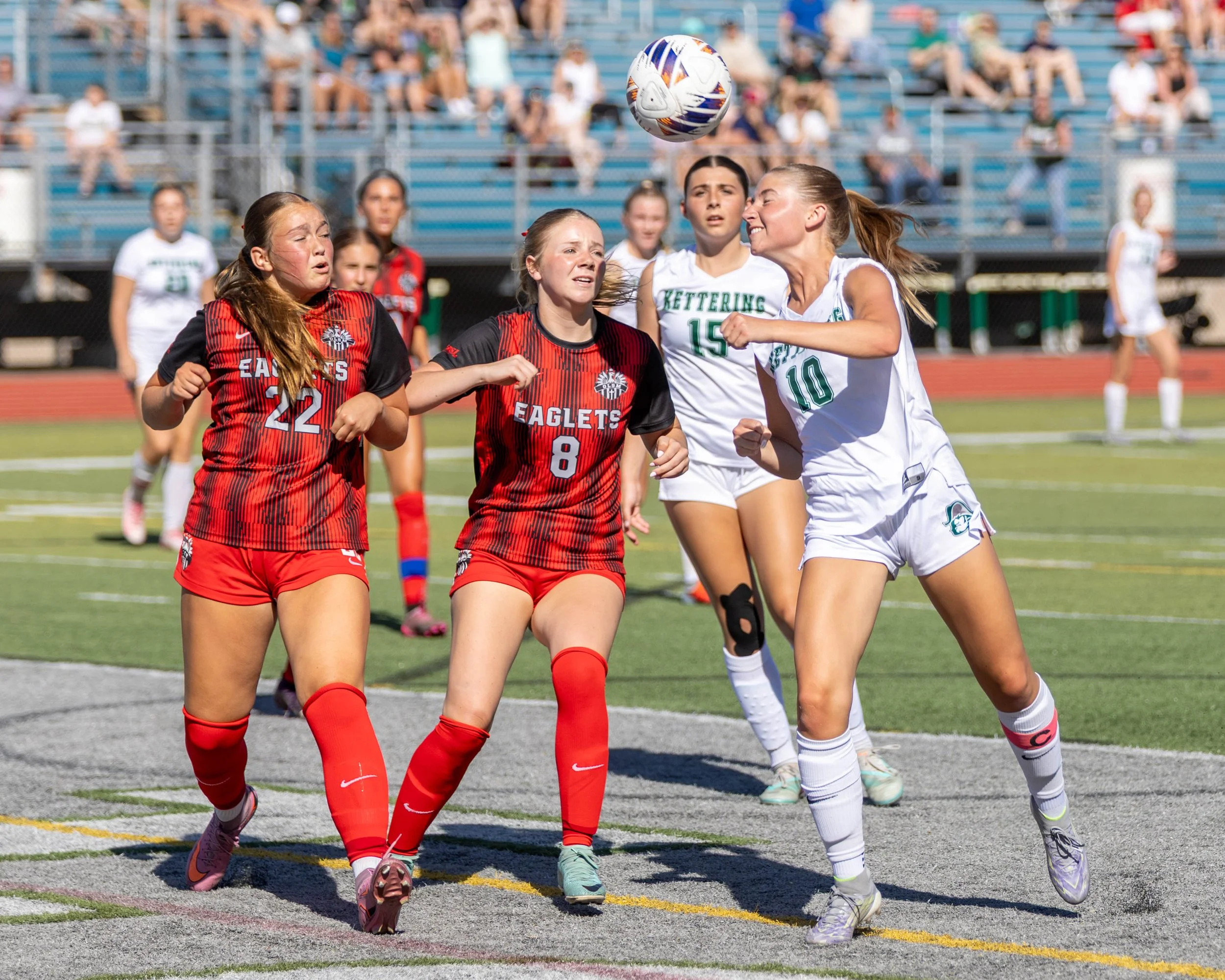 #10 heads the ball in the box