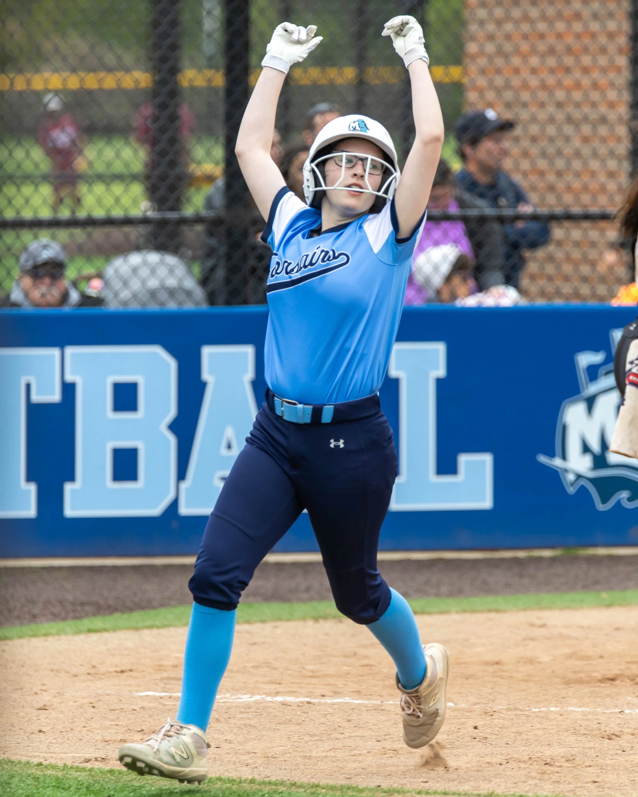 Mott runner celebrate scoring a run