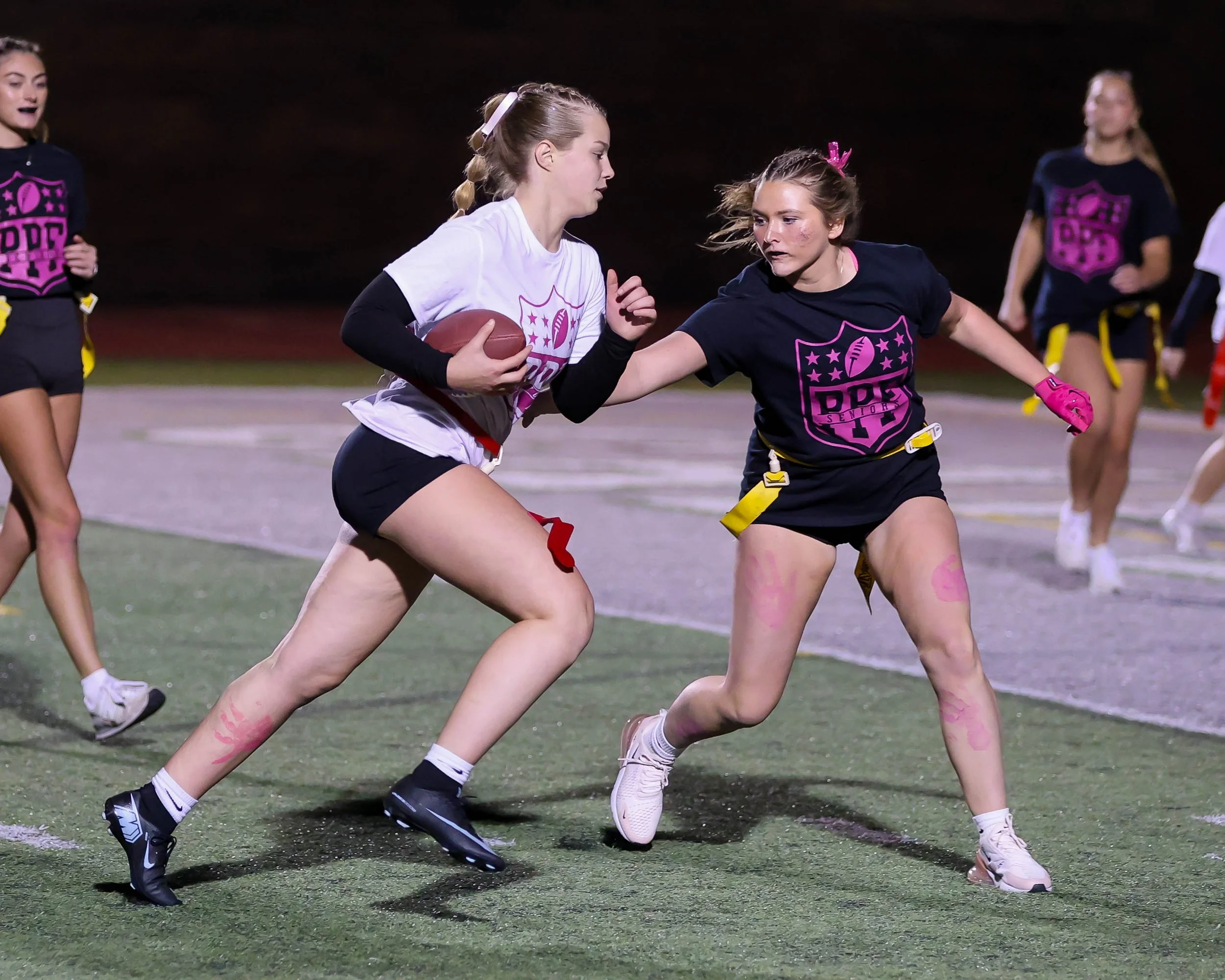 Junior quarterback run towards to end zone