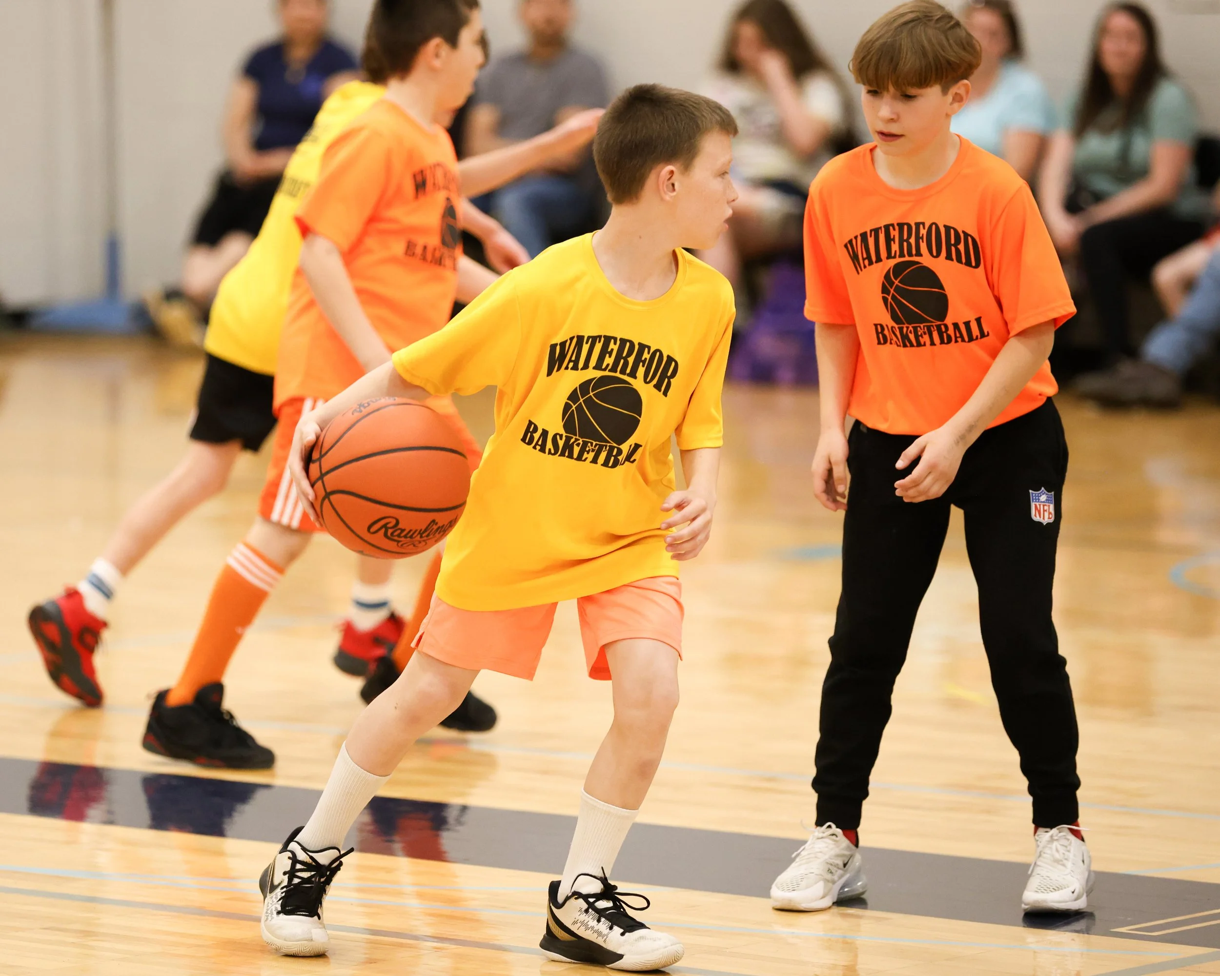 Schoolcraft boy dribbles past Knudsen boy