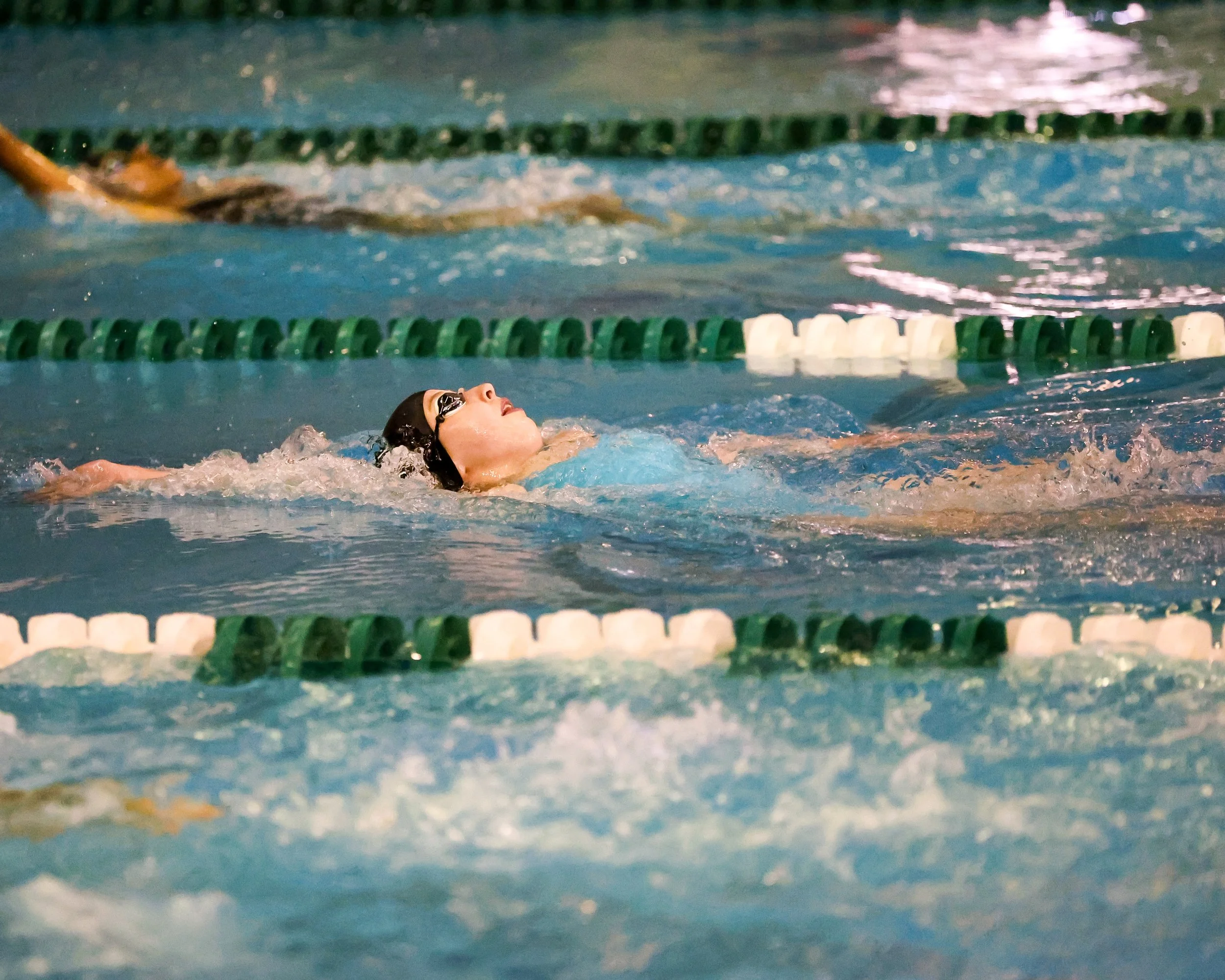 WU swimmer doing the backstroke