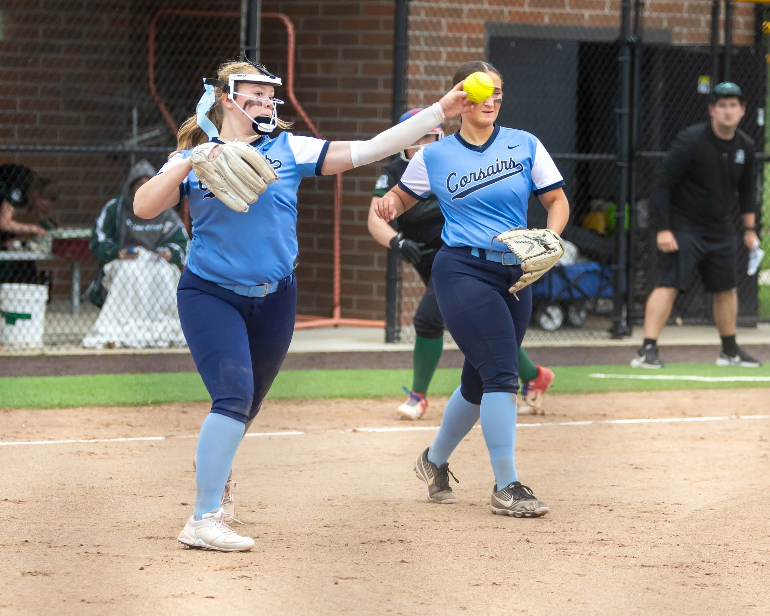 Mott pitcher throws the ball to first base
