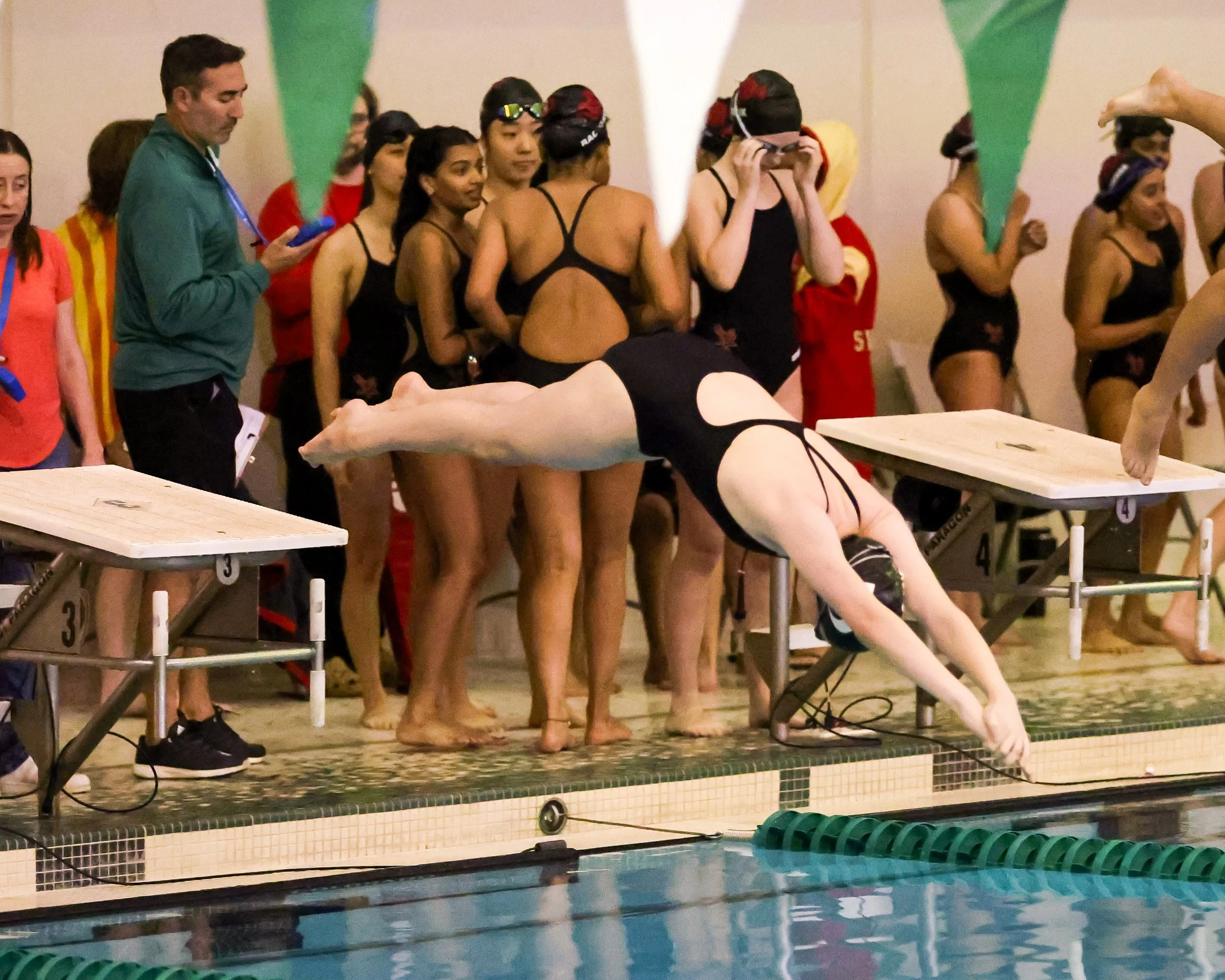 WU first swimmer starts the 400 Yard Freestyle Relay