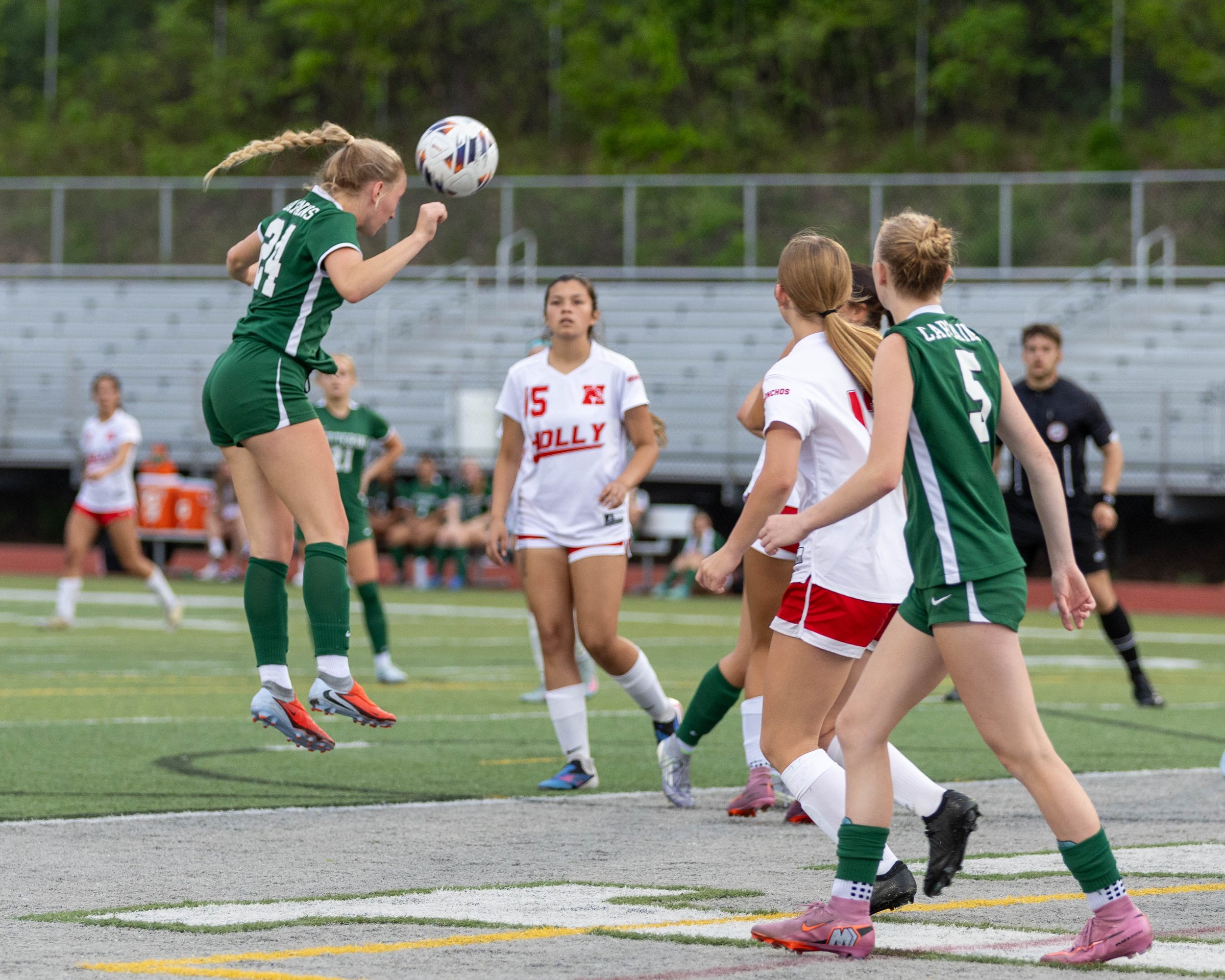#24 with a header towards the goal