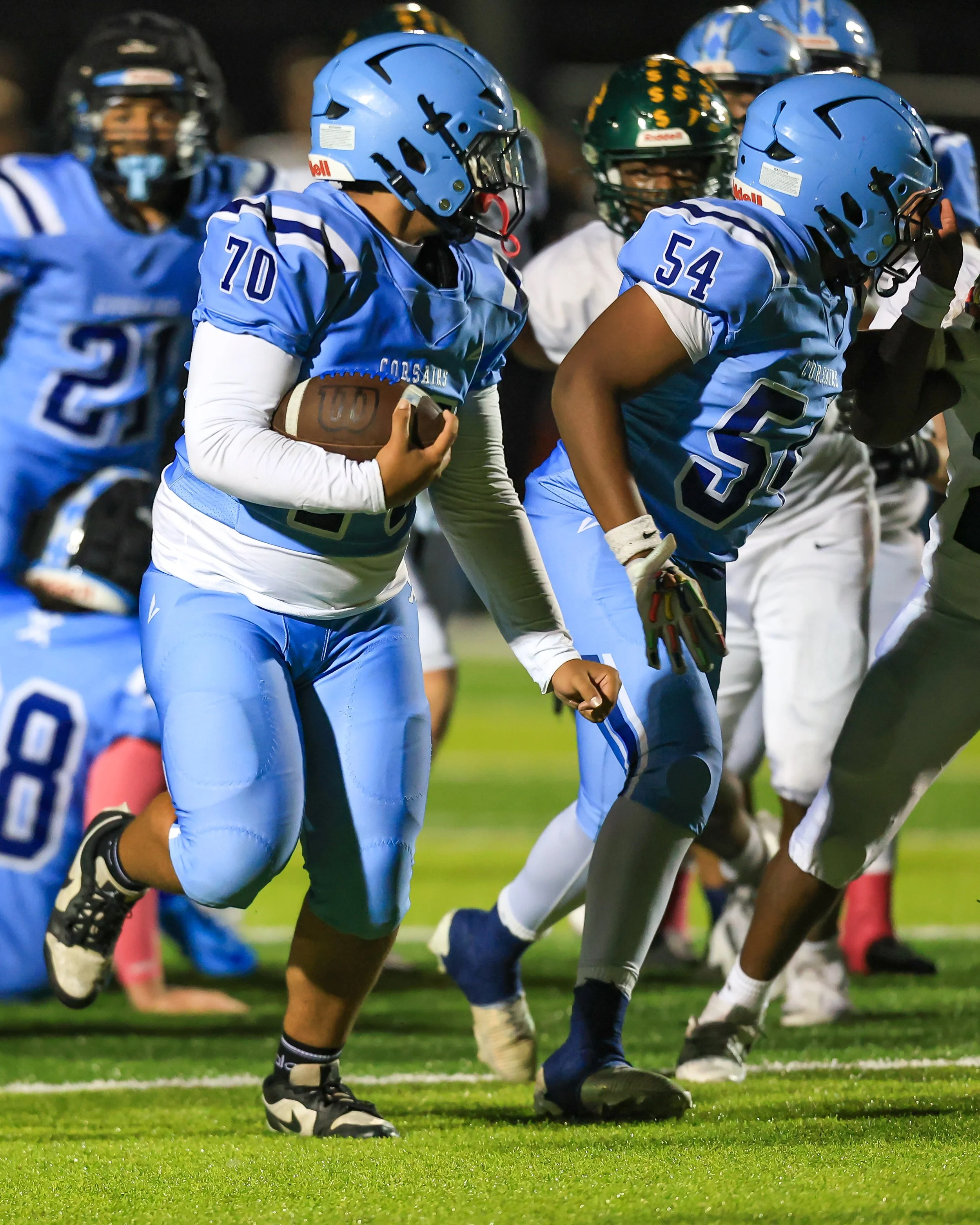 Mott #70 picks up a fumble and runs with the ball