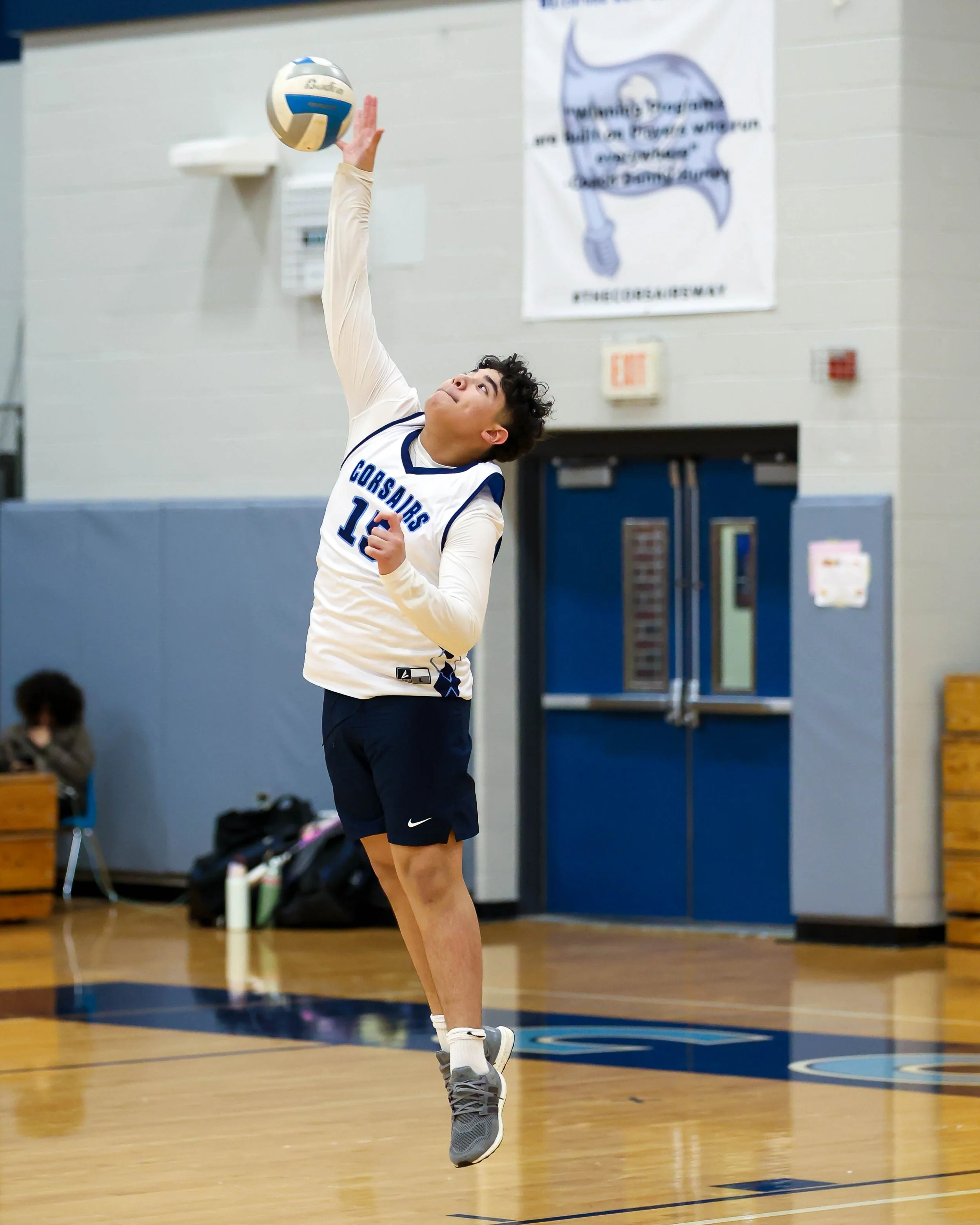 Mott #15 serves the ball