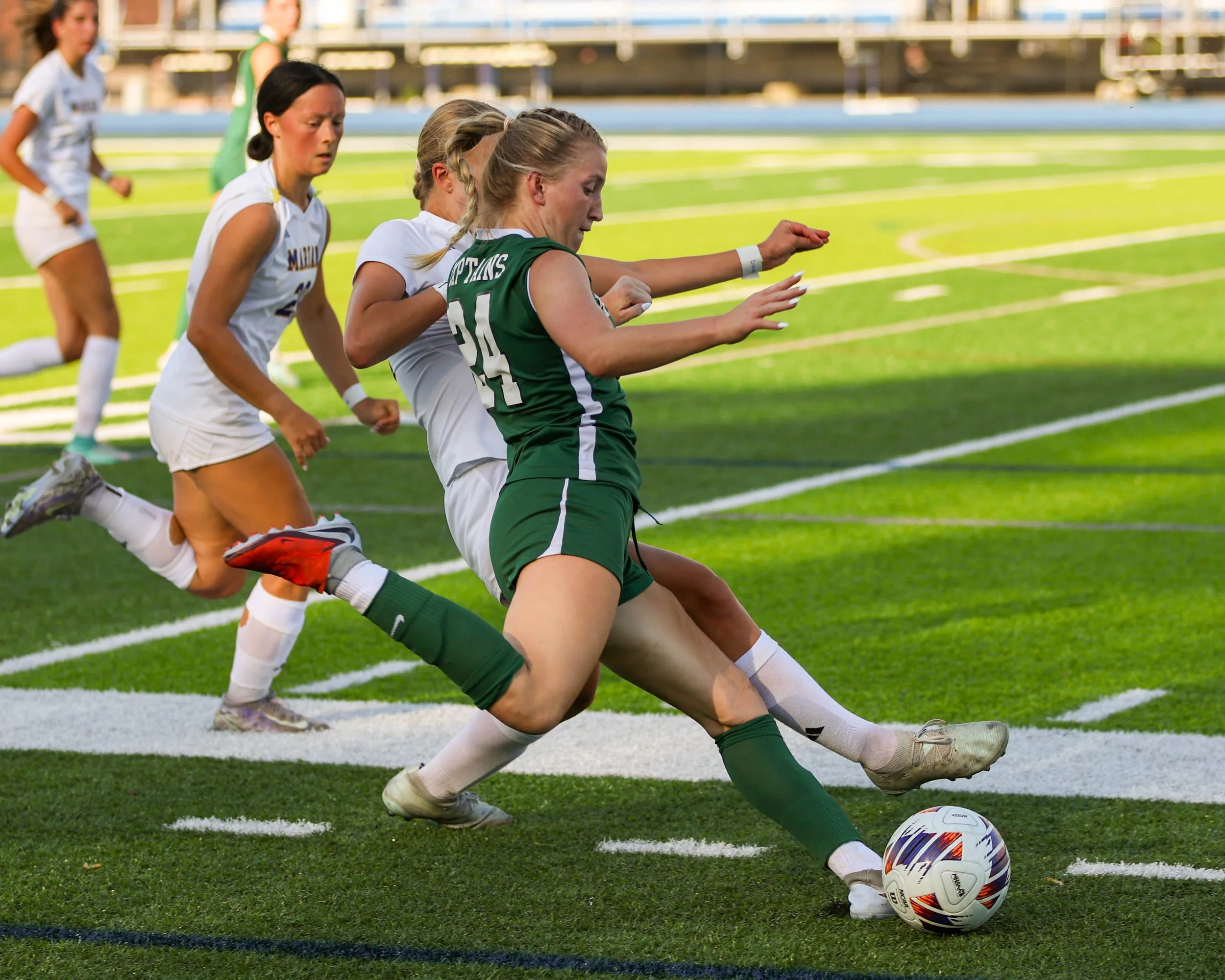 #24 goes to kick the ball