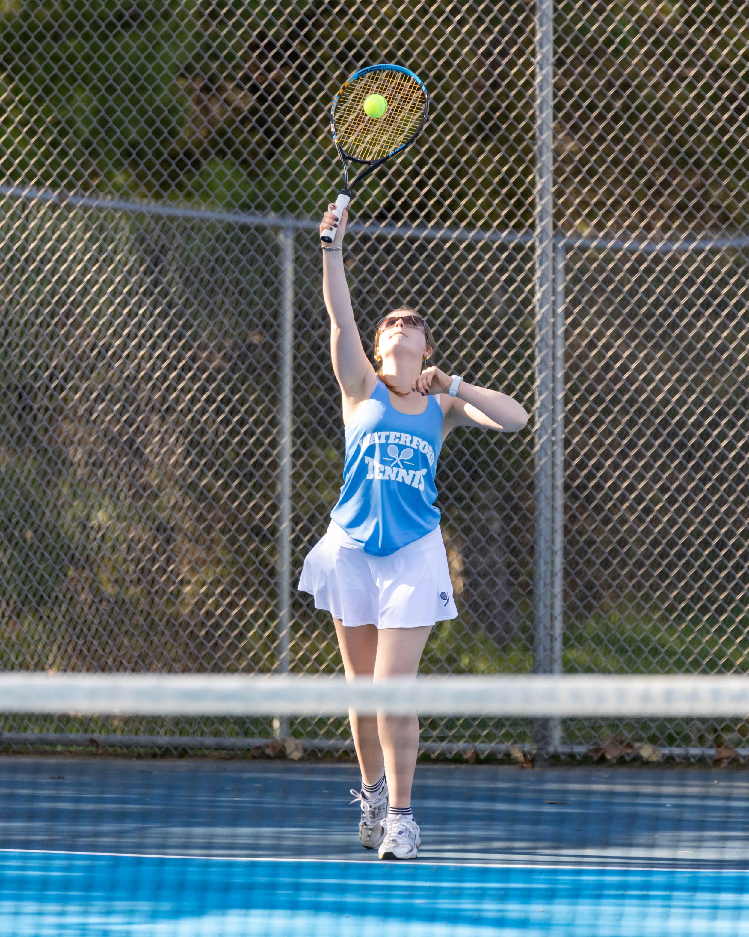 Waterford United player serves the ball