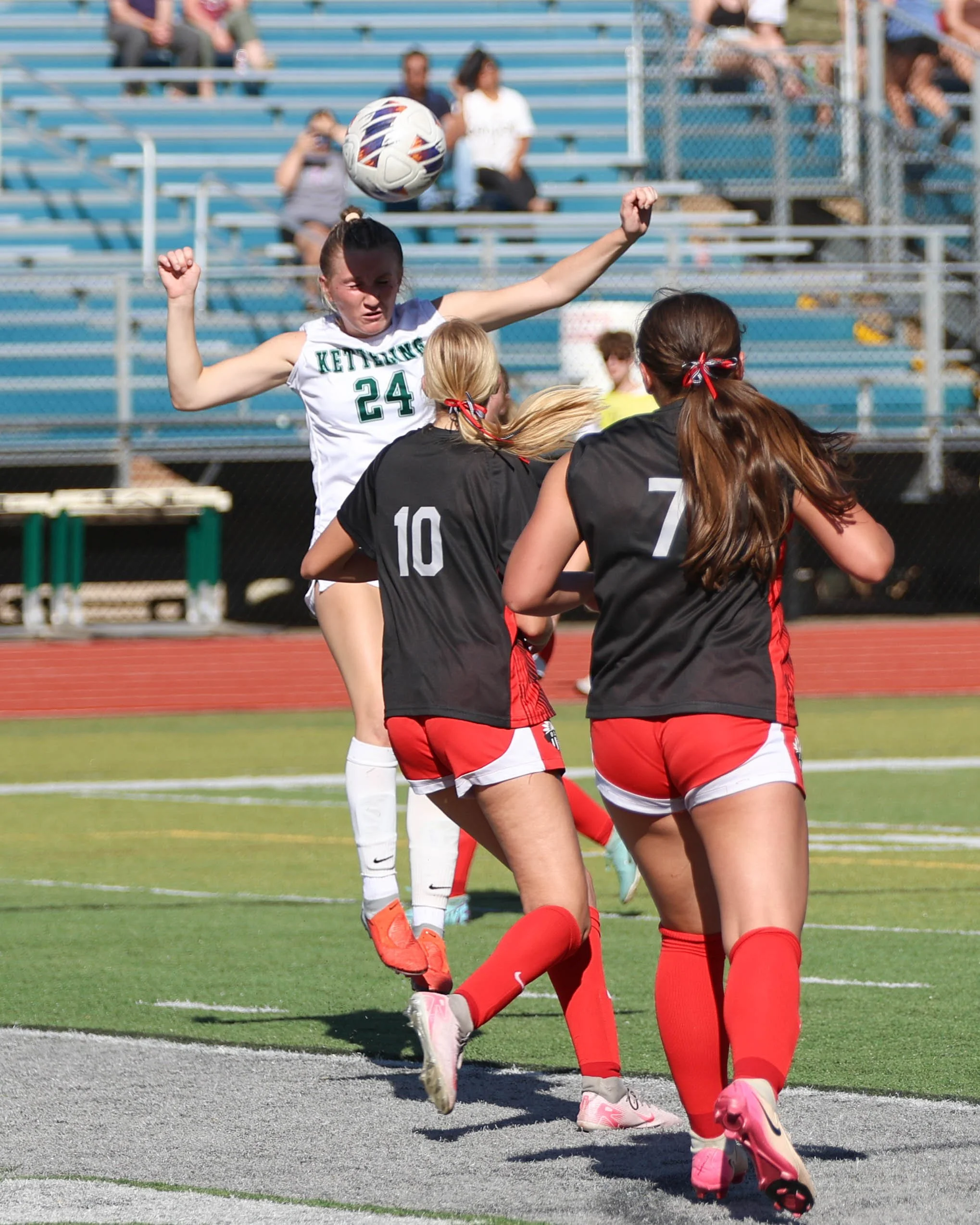 #24 heads the ball from a corner