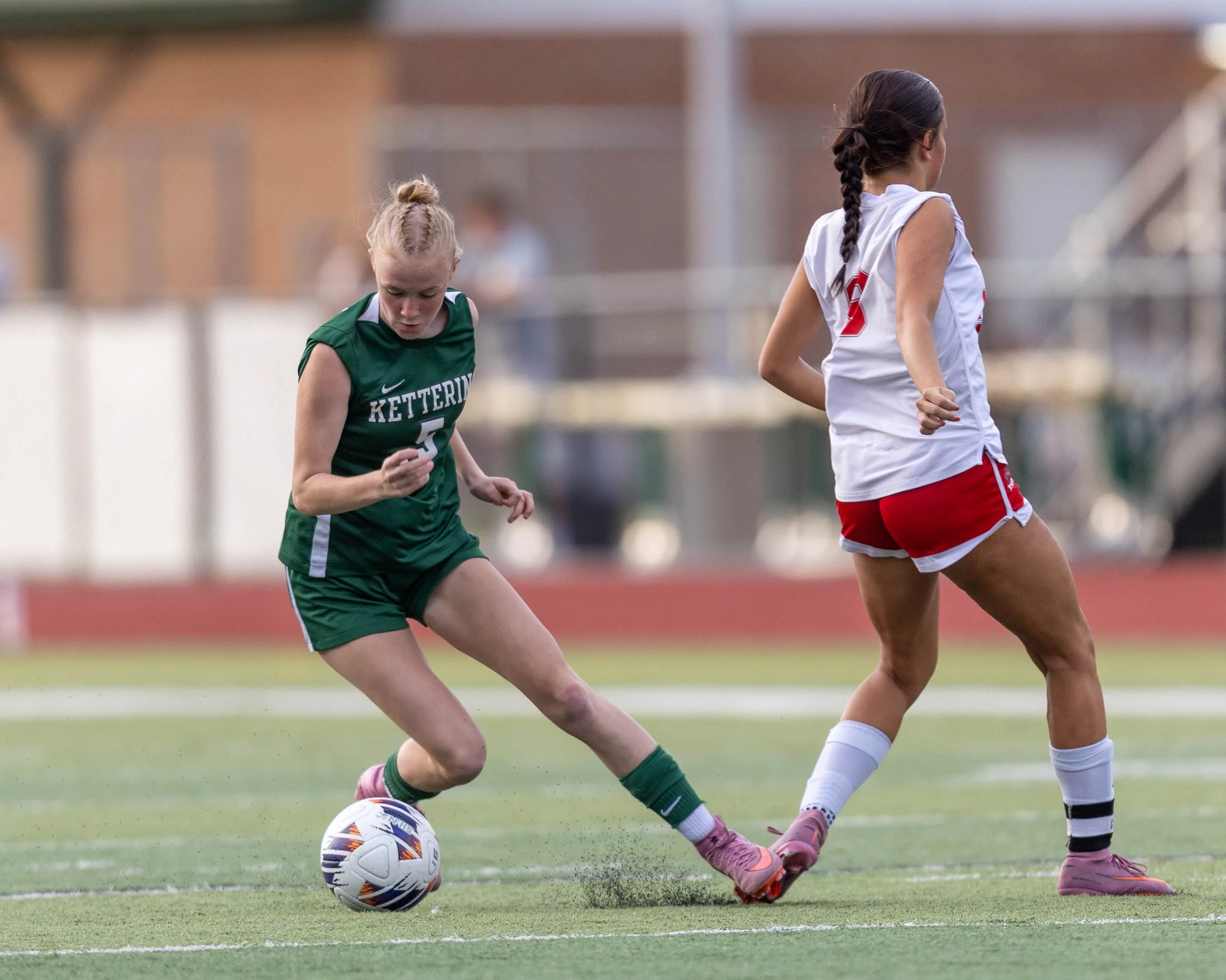 #5 cuts back against a defender