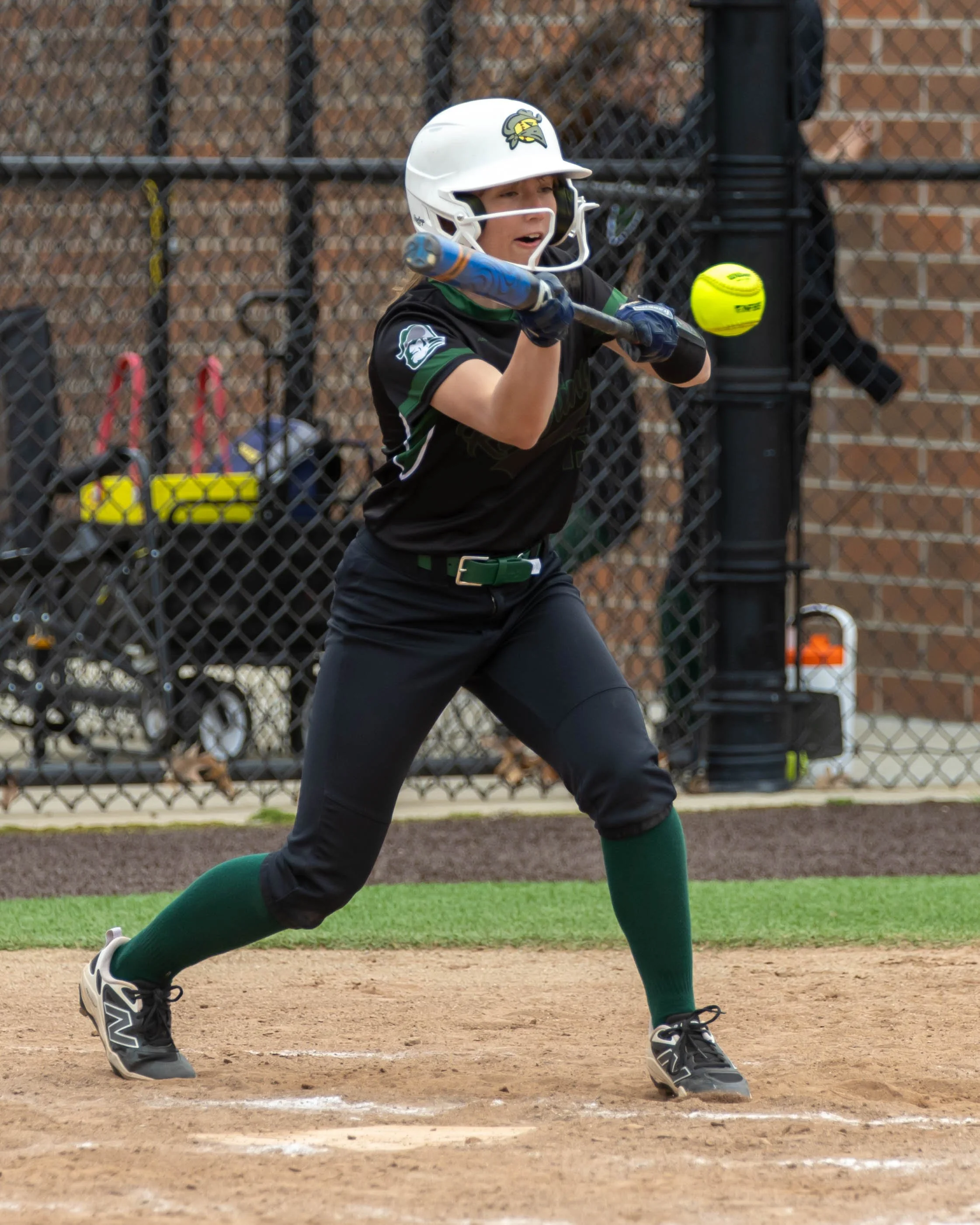 Kettering player bunts the ball