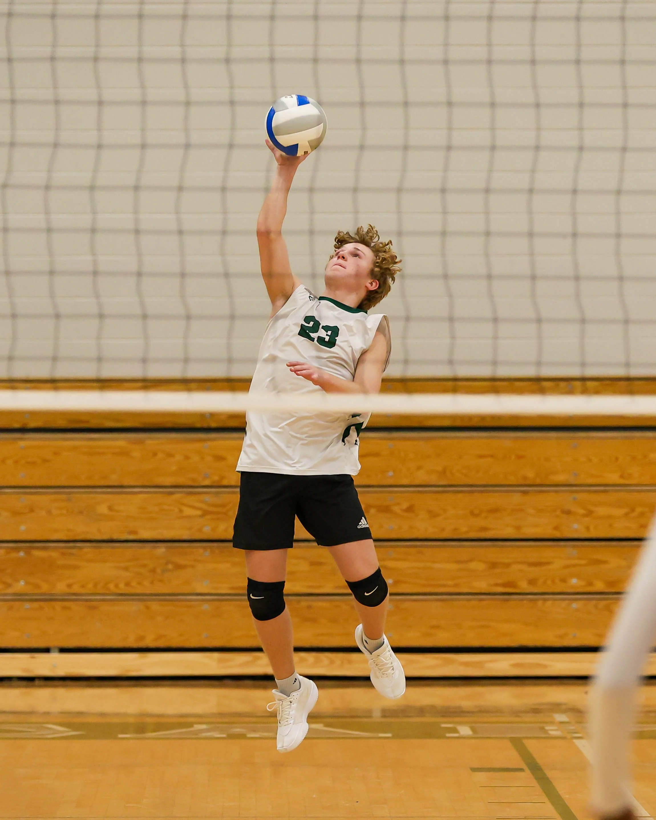Kettering #23 serves the ball