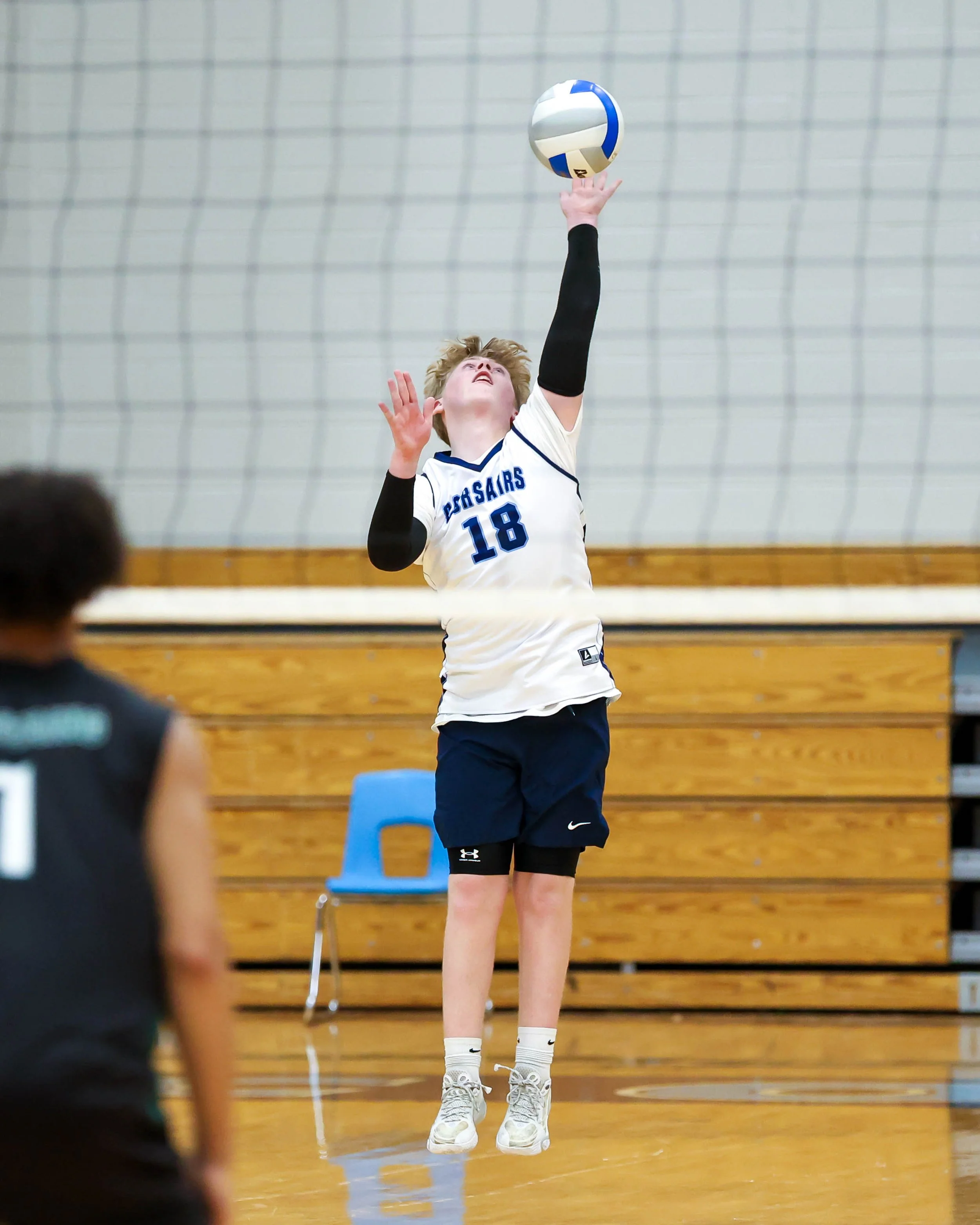 Mott #18 serves the ball