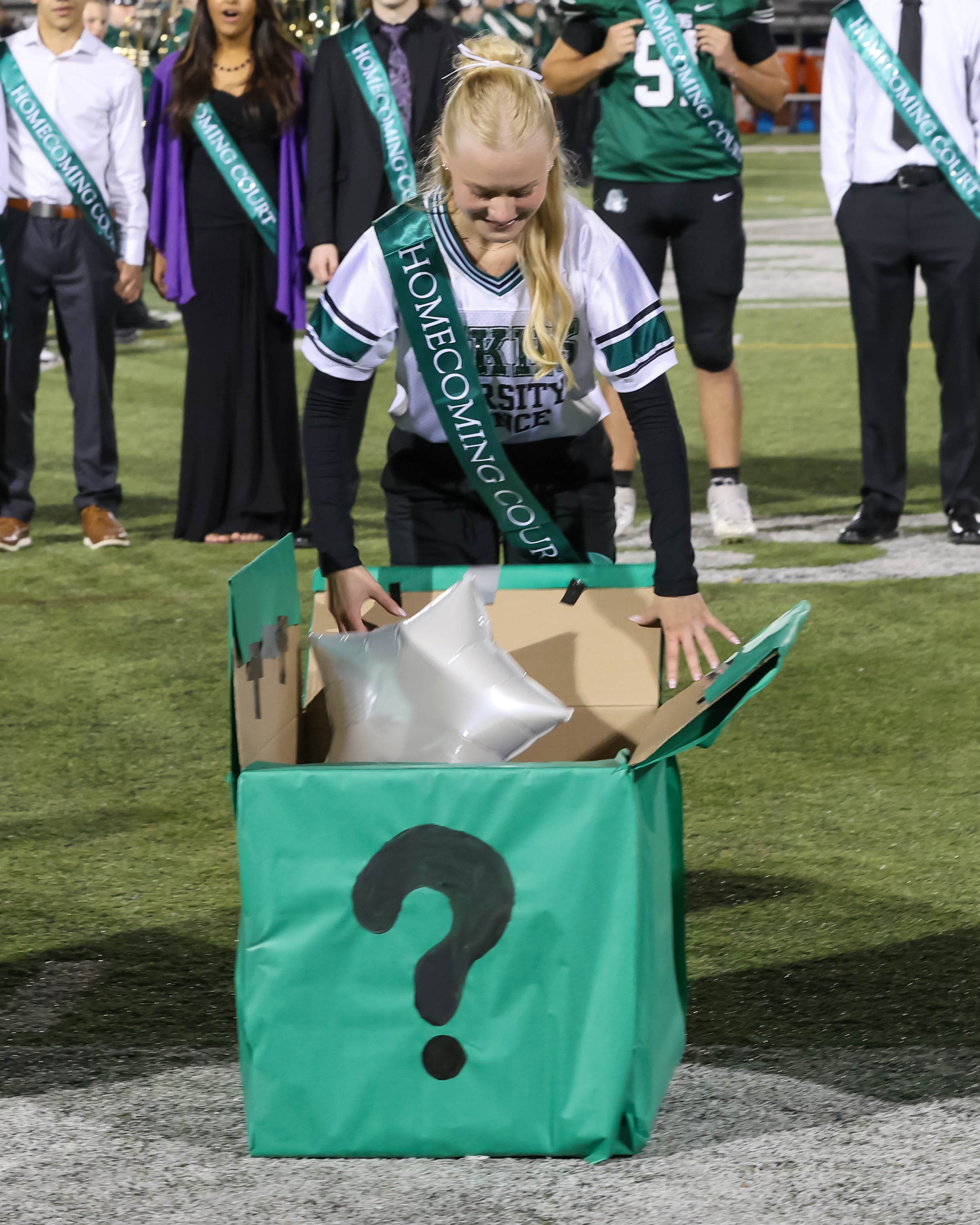 WK Homecoming Court finalist opening box