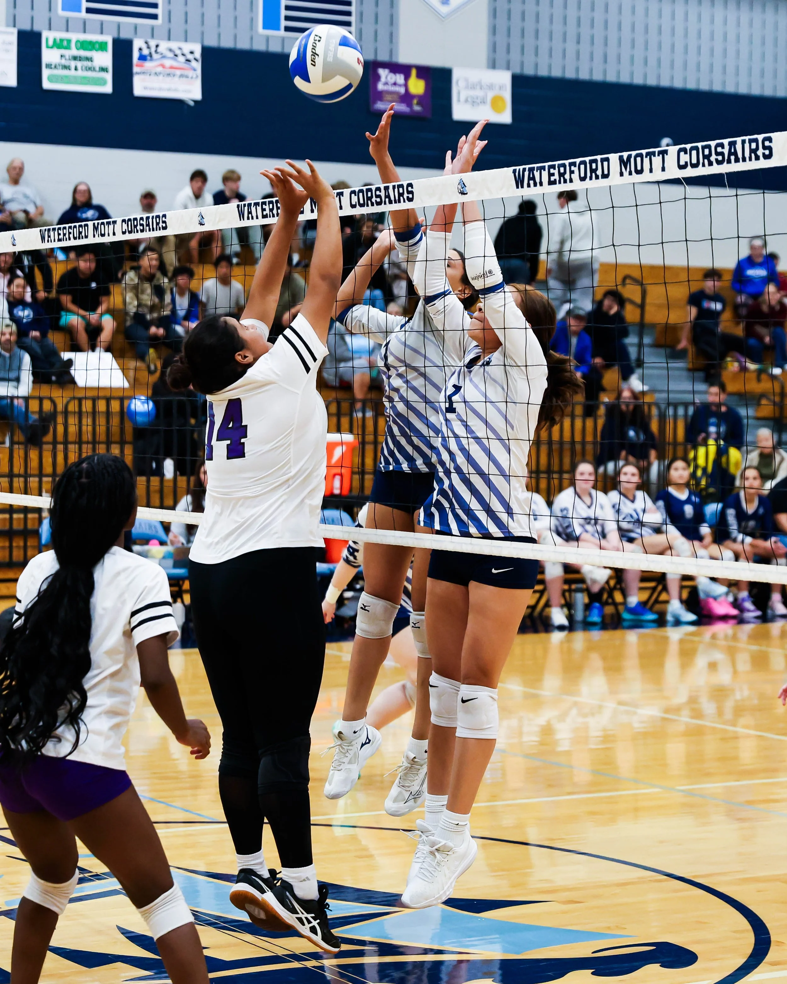 Mott #1 and #7 rip to block the ball