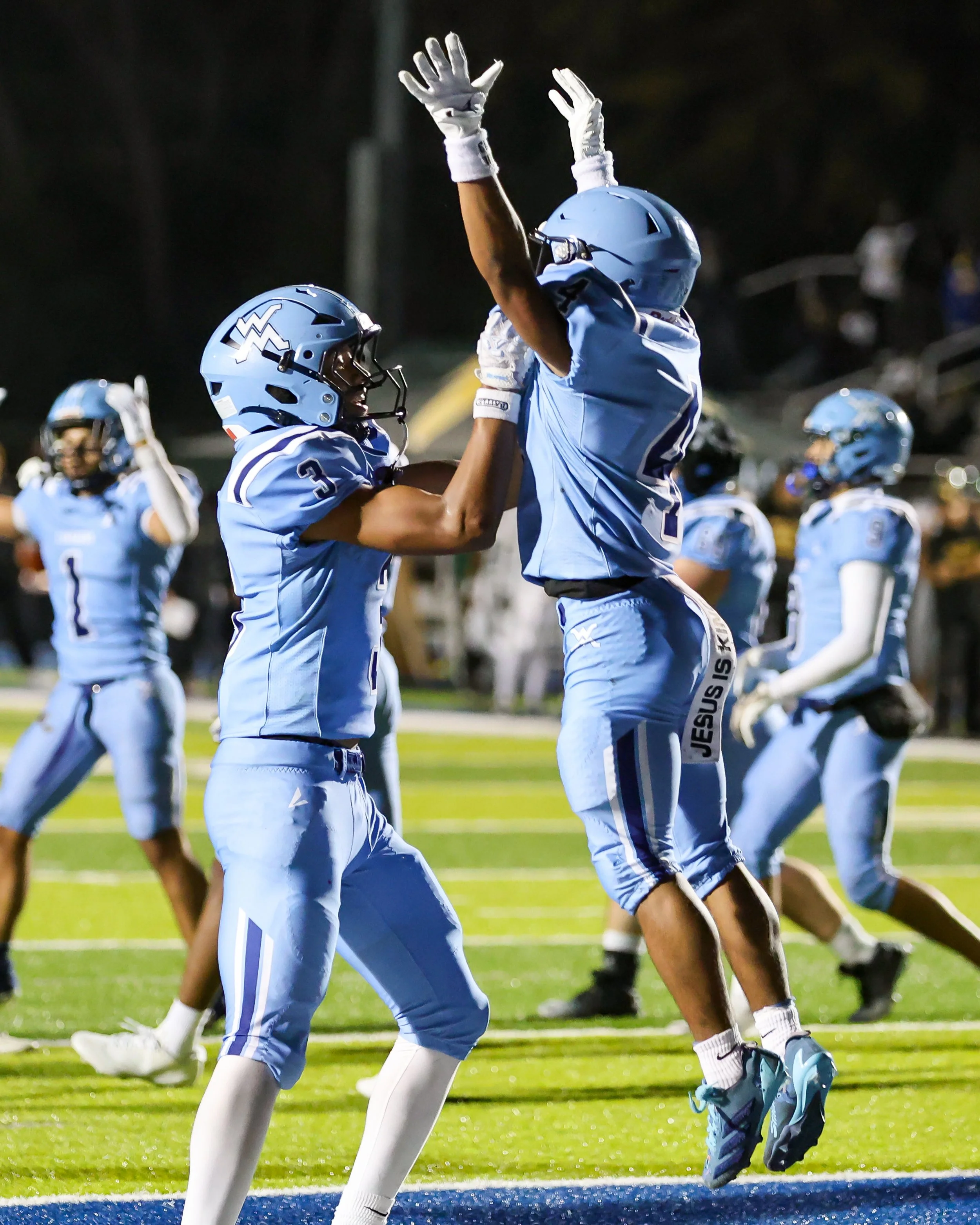 Mott #4 gets a lift after scoring a touchdown
