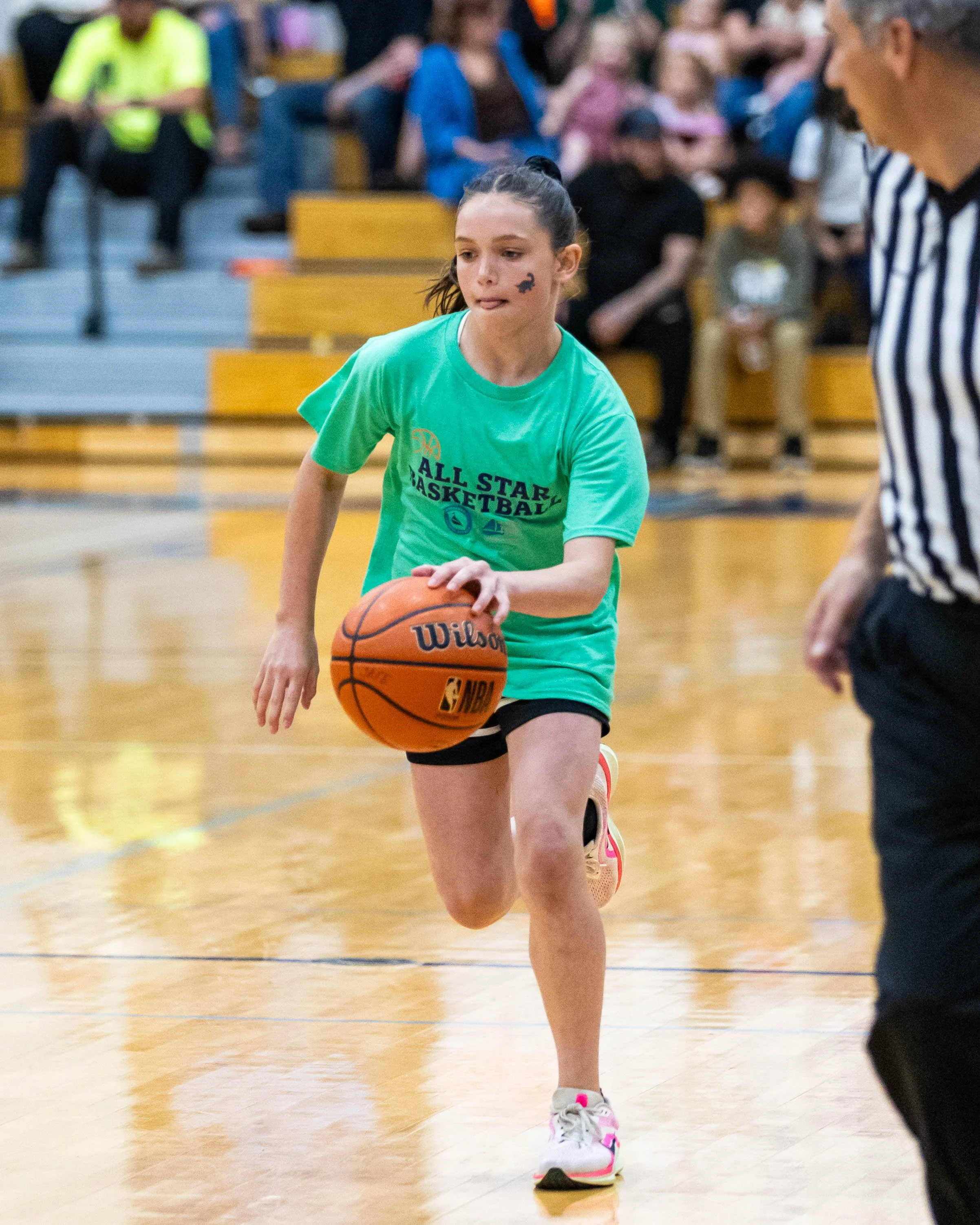 South girl dribbles the ball