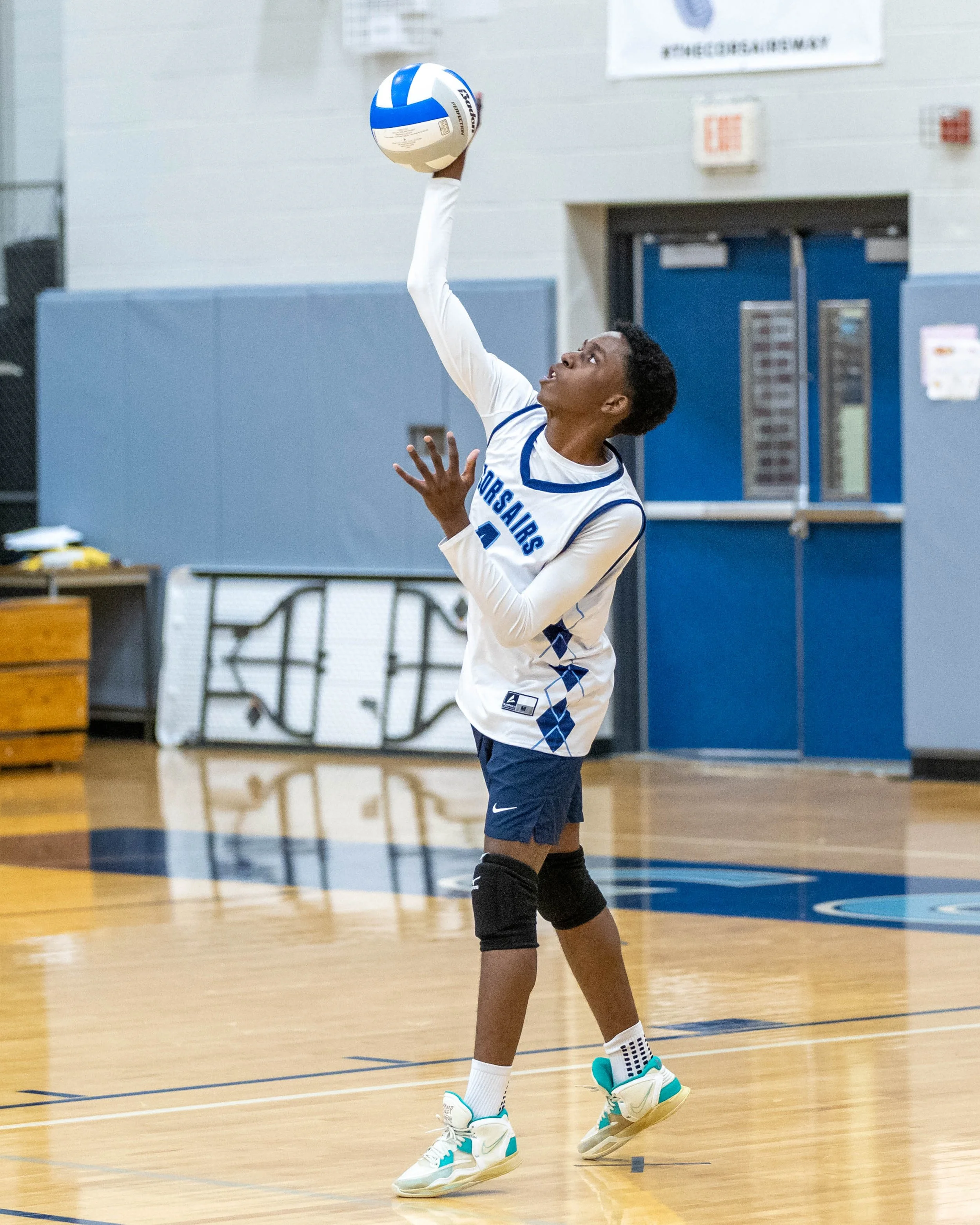 #4 serves the ball